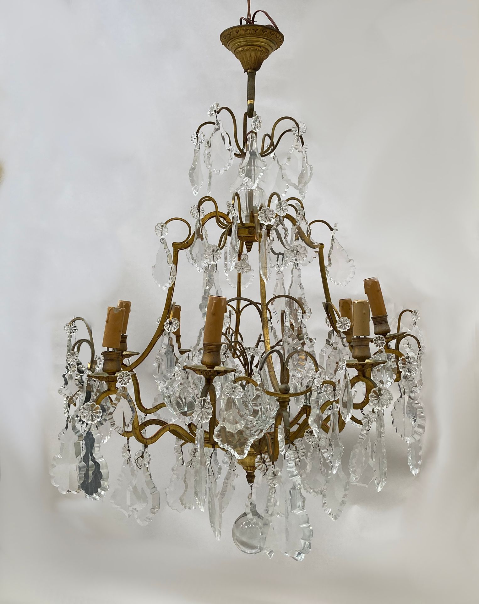 Null Twelve-light gilt bronze cage chandelier. The arms with curves and angles. &hellip;