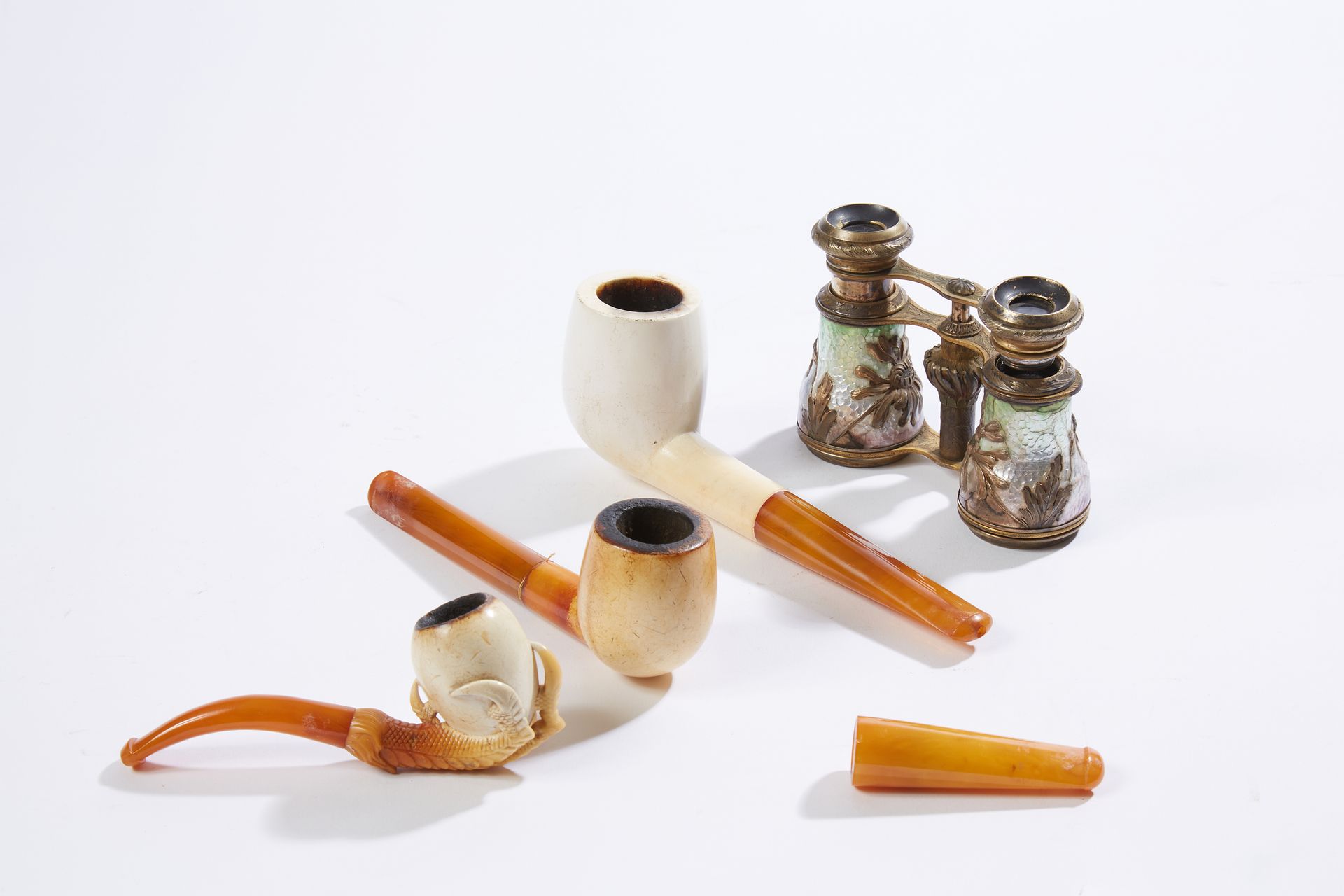 Null Set of display items including meerschaum pipes and a pair of enamelled bra&hellip;