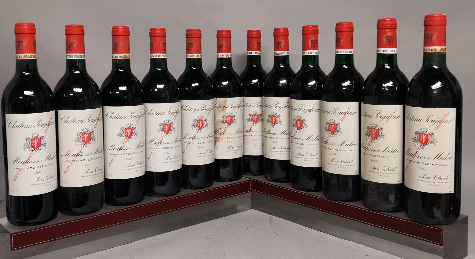 Null 12 bouteilles Château POUJEAUX - Moulis 1989 

3 niveaux base goulot. Etiqu&hellip;
