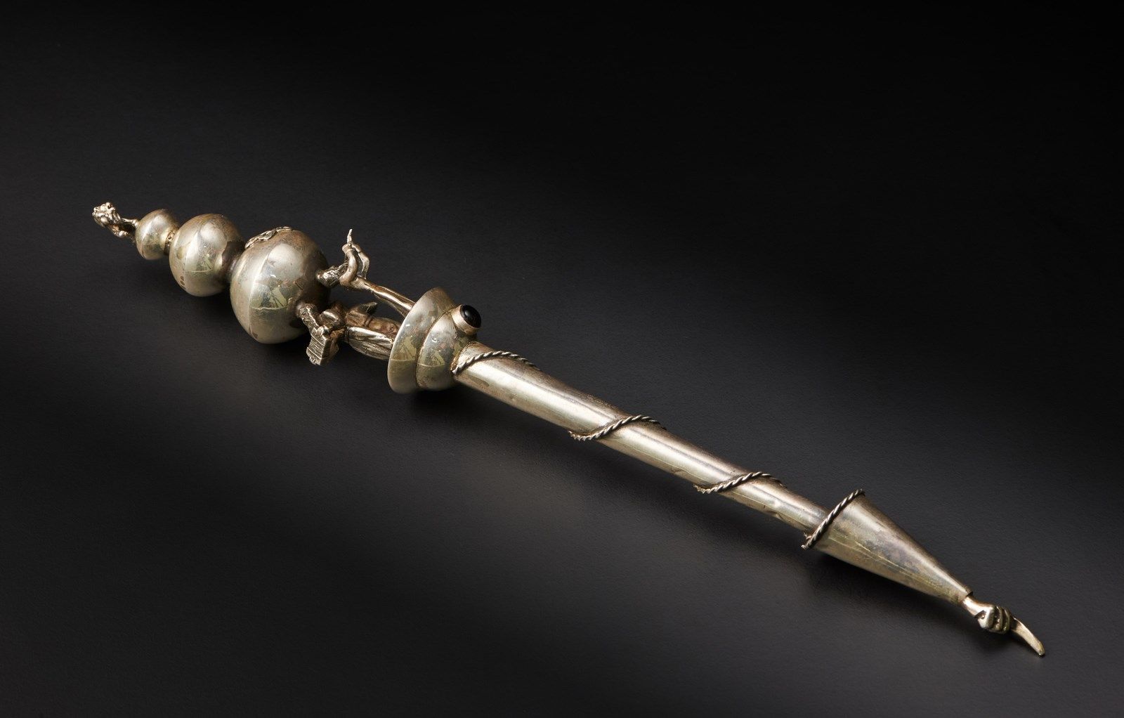 . A silver Torah pointer (Yad) decorated with characters and overlapping geometr&hellip;