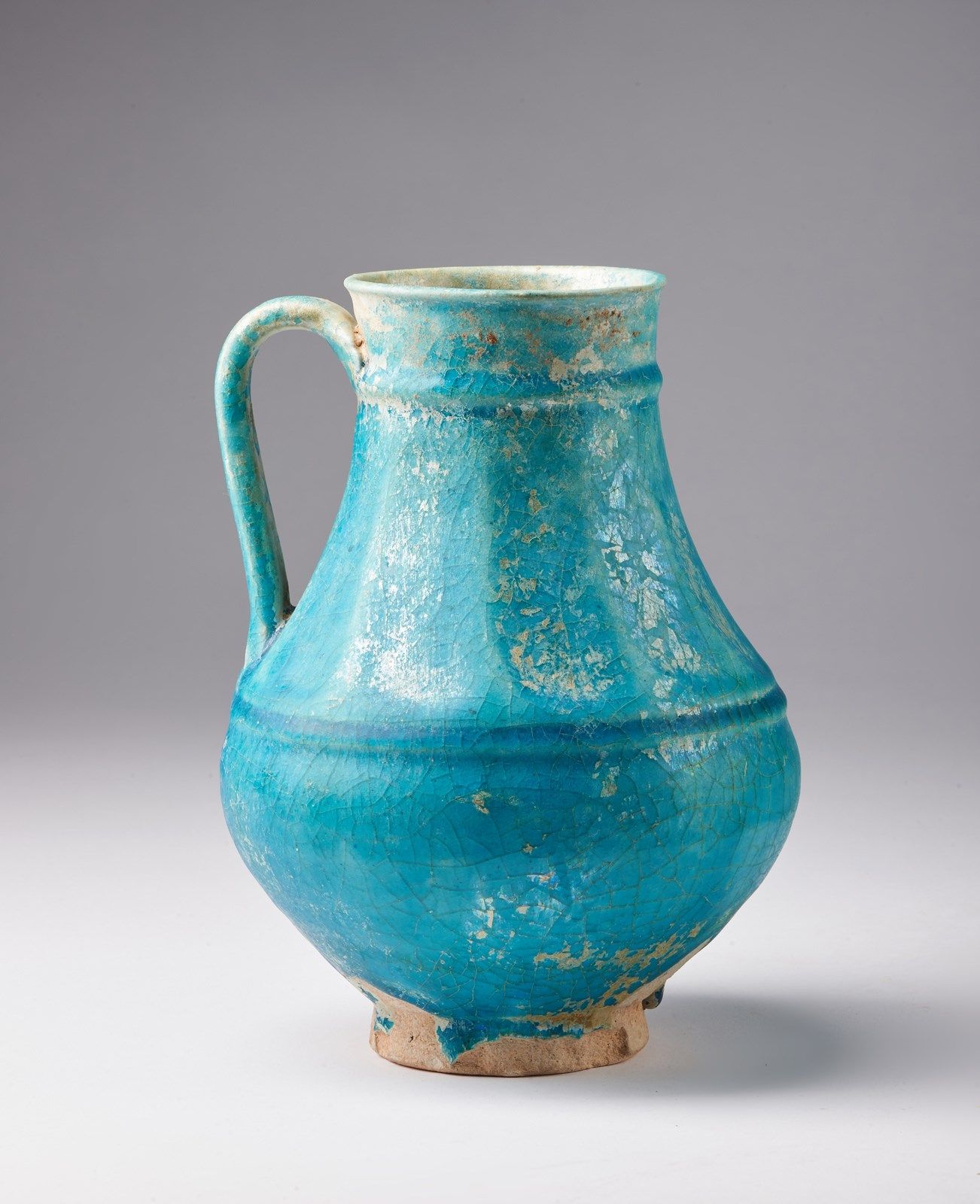 Arte Islamica A large Kashan turquoise glazed ewerIran, late 12th - early 13th c&hellip;