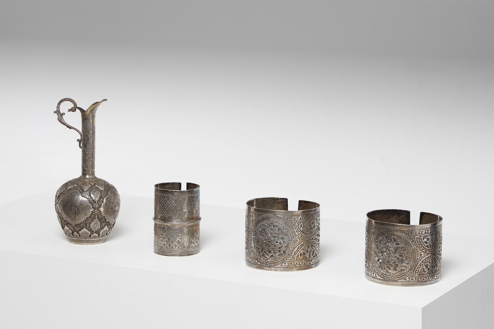 Arte Islamica A group of three silver bangles and a silver jug Persia, 19th - 20&hellip;
