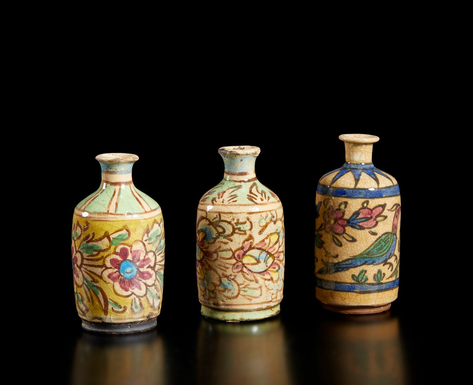 Islamic Art A group of three pottery bottle vases painted with floral decoration&hellip;