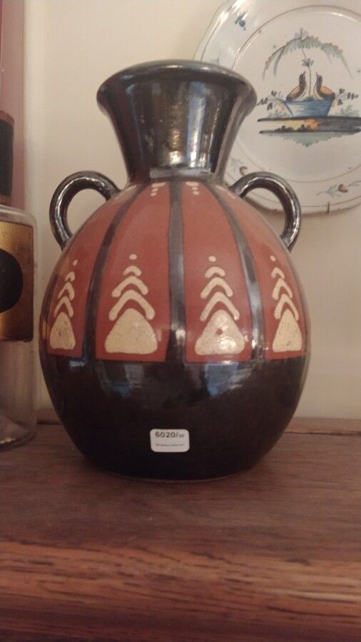 Null Paul JACQUET (1883-1968)

Vase en partie émaillé

Haut. : 27 cm