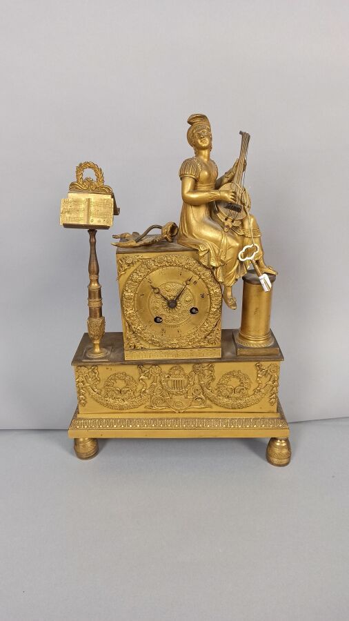 Null Gilt bronze clock decorated with the allegory of music surrounded by a musi&hellip;