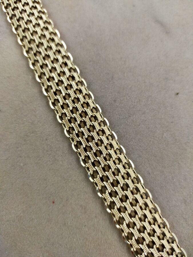 Null Bracelet articulé en or jaune 750 millièmes gravé et ajouré.
Longueur : 19 &hellip;
