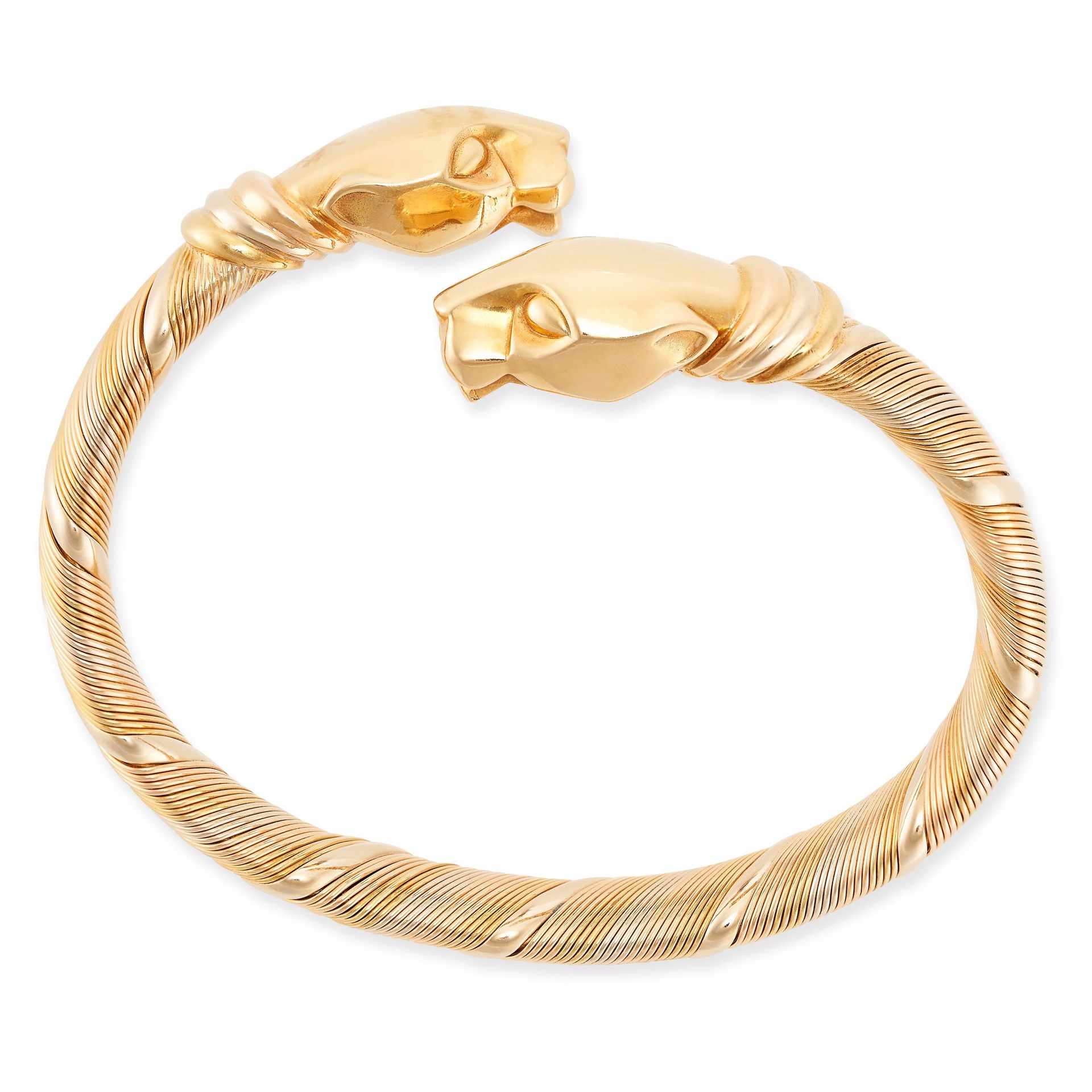 Null CARTIER, A VINTAGE PANTHERE DE CARTIER BANGLE in 18ct yellow, white and ros&hellip;