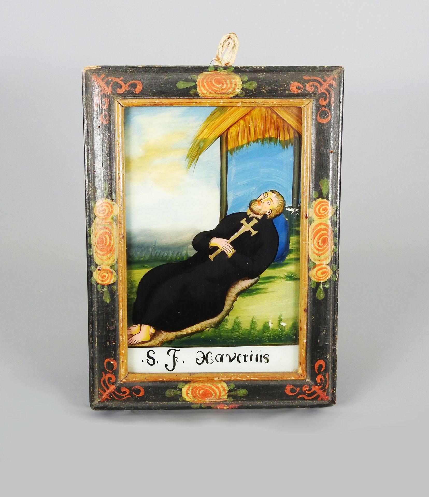 Heiliger Xaverius 反面玻璃上的绘画。圣-夏维里乌斯胸前挂着十字架躺在一间小屋前。Min. F.A., rest., age-related g&hellip;