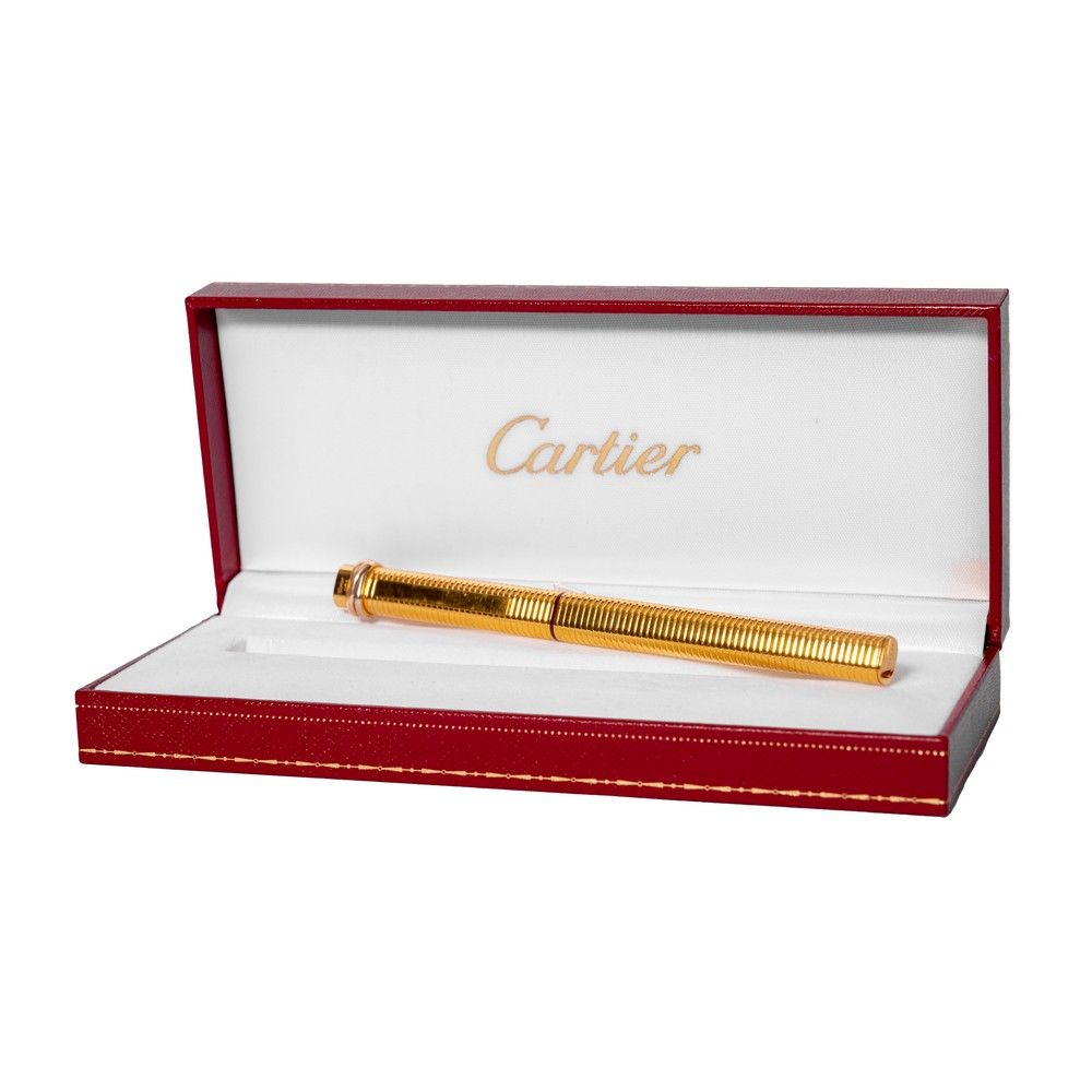 CARTIER PENNA in oro placcato entro astuccio originale. CARTIER镀金钢笔，带原包装盒。