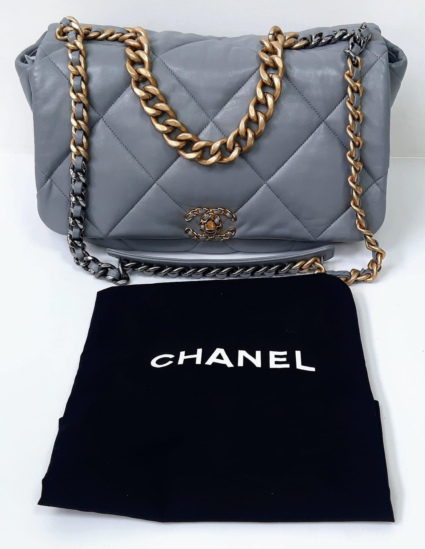 A Chanel 19 Maxi Grey Leather Flap Bag. Soft quilted lea…