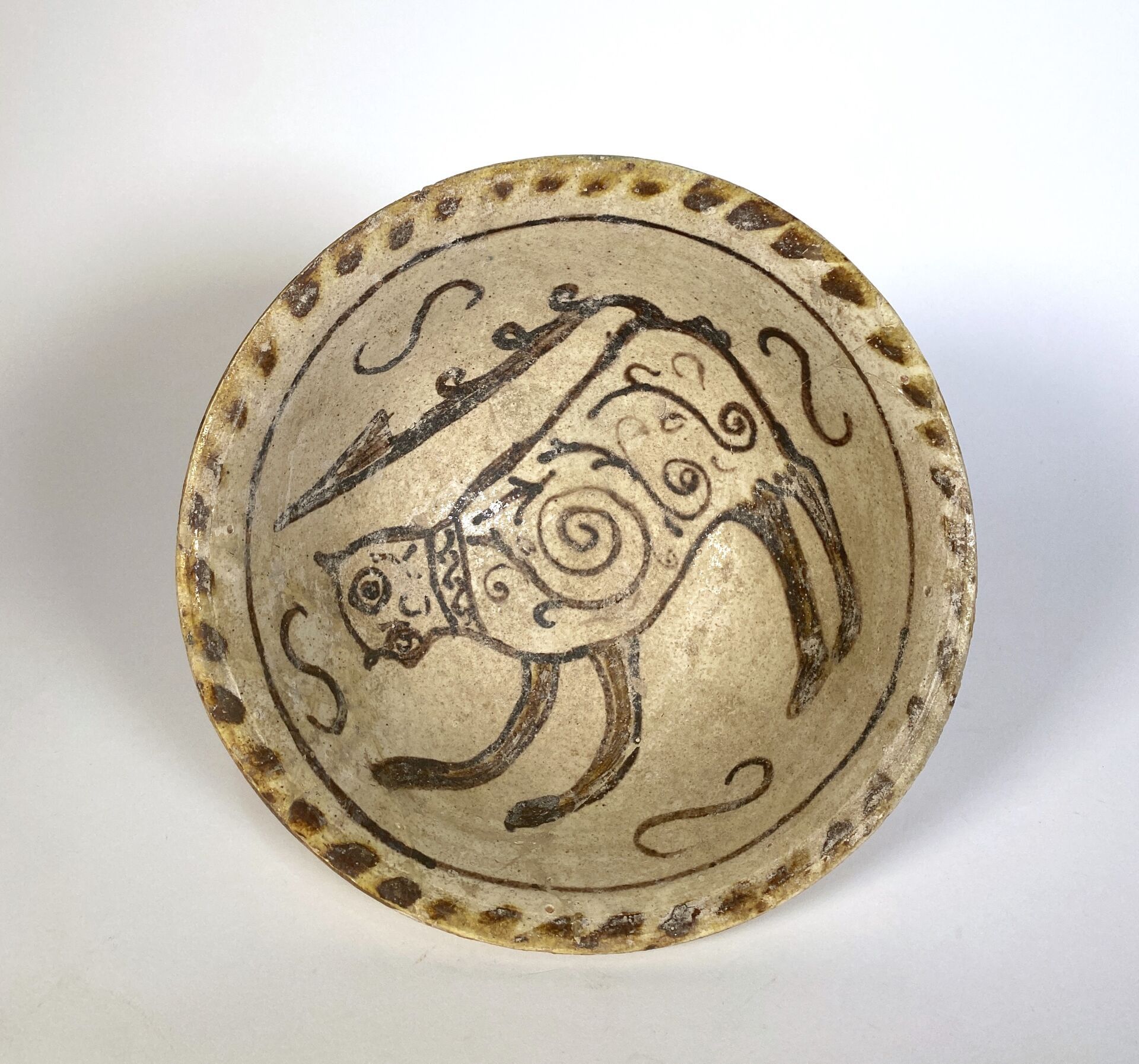 Null Rare underglaze painted deep bowl of a feline, tail upturned.
Islamic Persi&hellip;