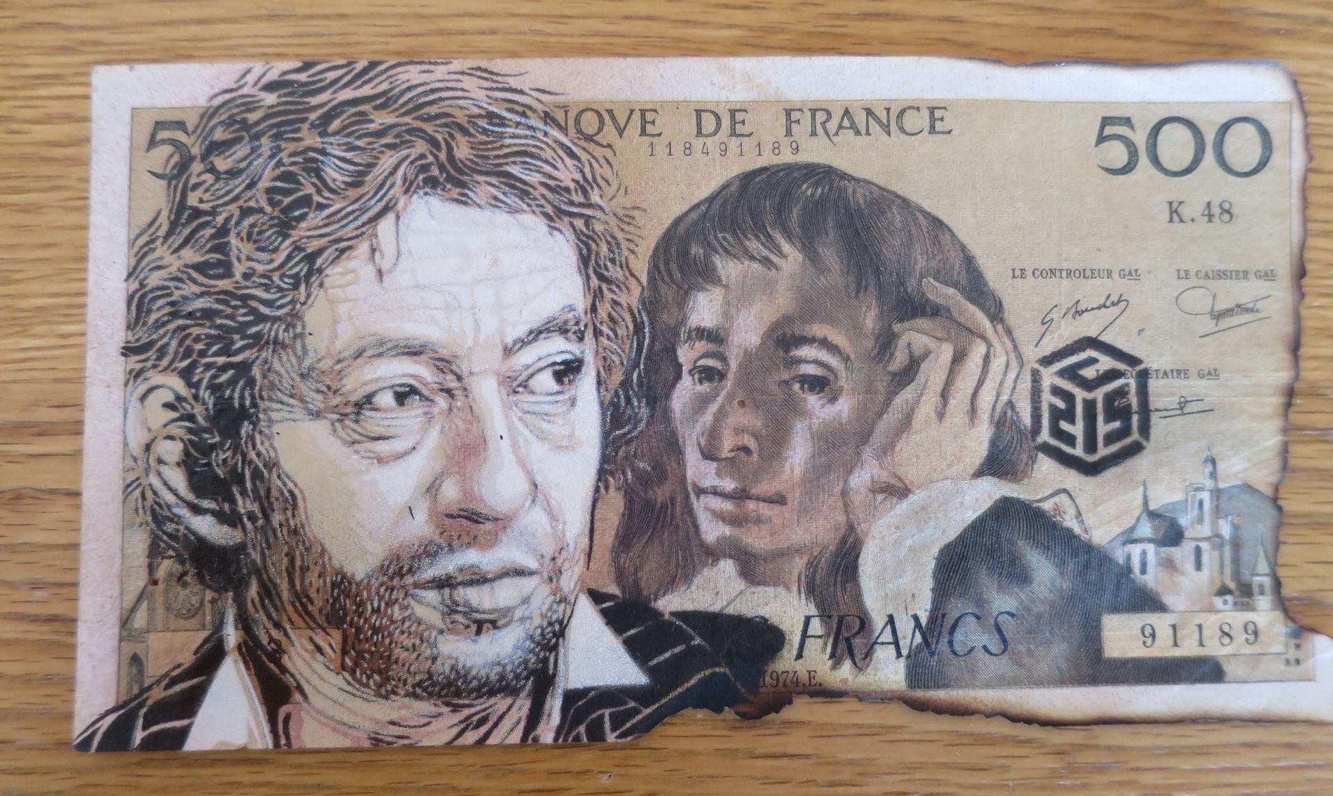 C215 C215

 Gainsbourg, 2021

 

 Aerosol on banknote

 The work was obtained di&hellip;