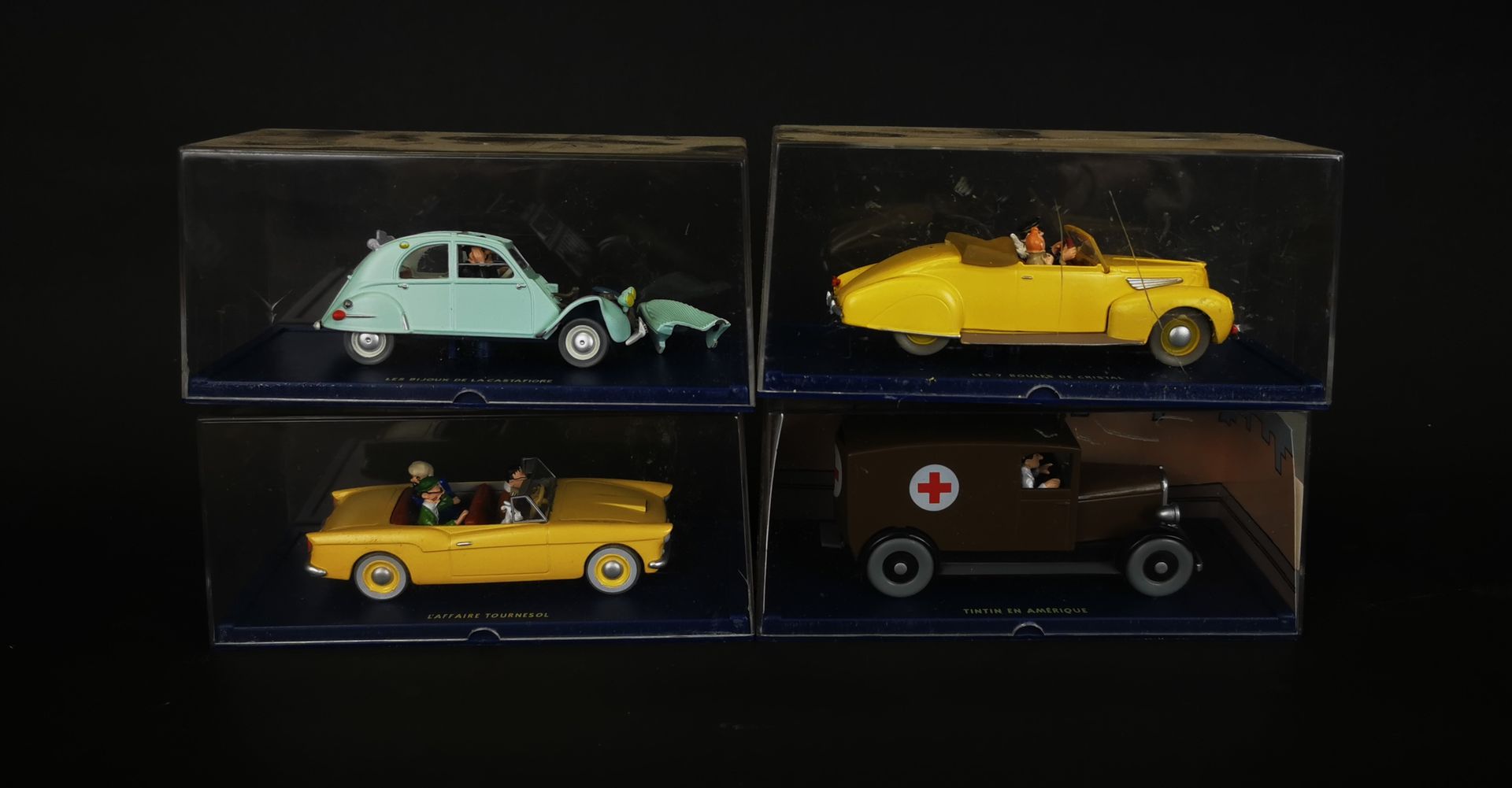 Null HERGE-MOULINSART lot of 4 vehicles representing the adventures of Tintin.