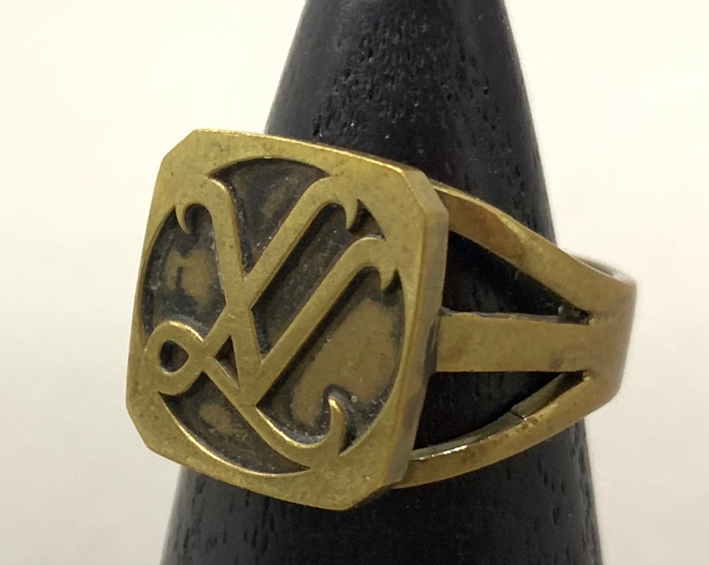 LOUIS VUITTON. Bronze signet ring with the LV monogram o…