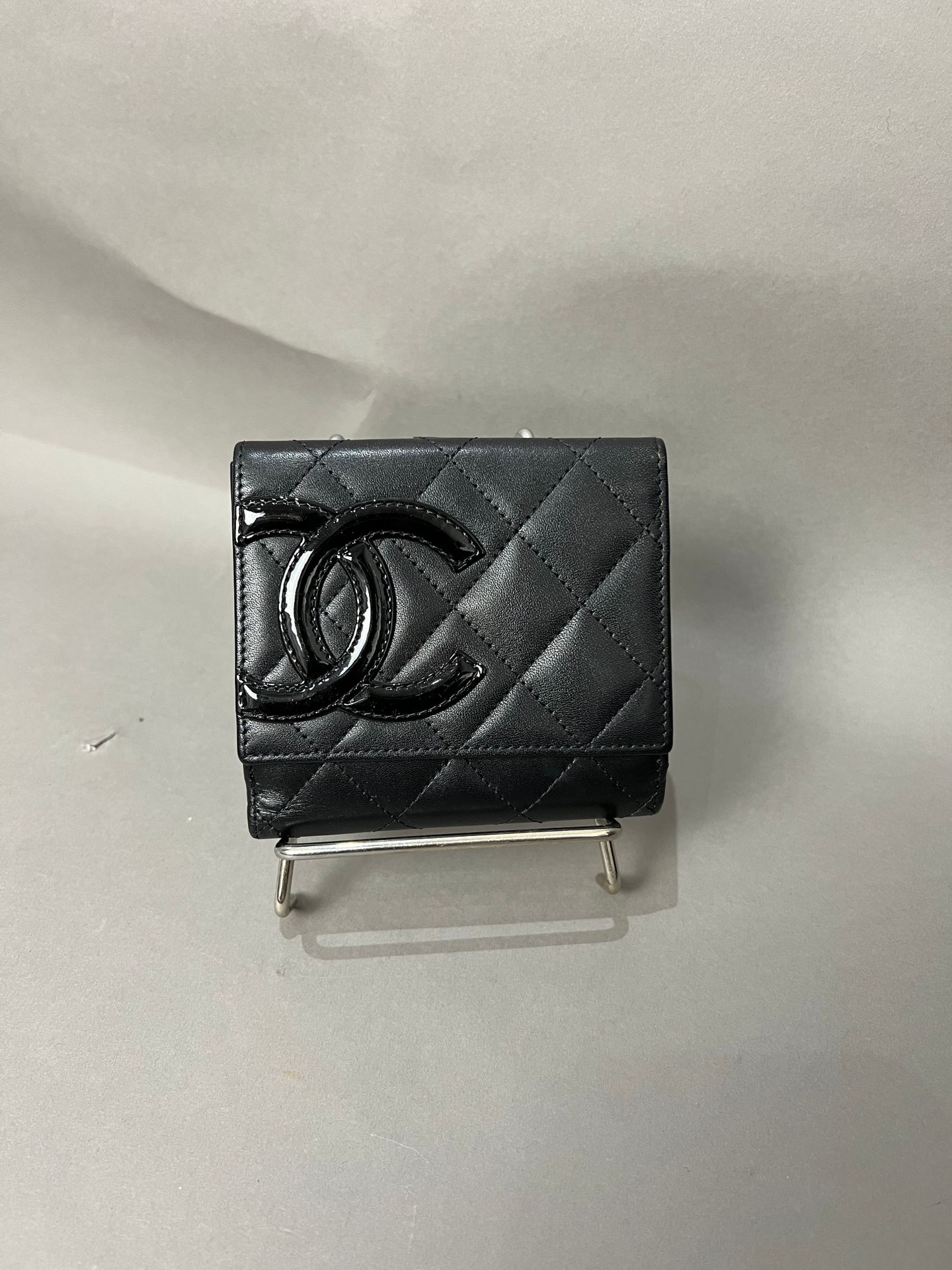 CHANEL. Black quilted leather wallet, double C in patent…