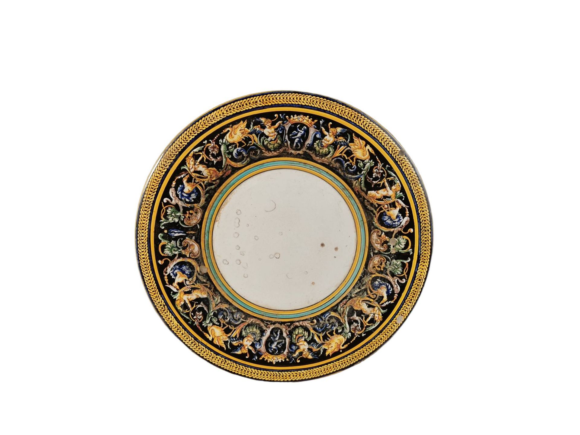 Null GIEN. Enamelled earthenware dish with grotesque decoration. D.34 cm. Slight&hellip;
