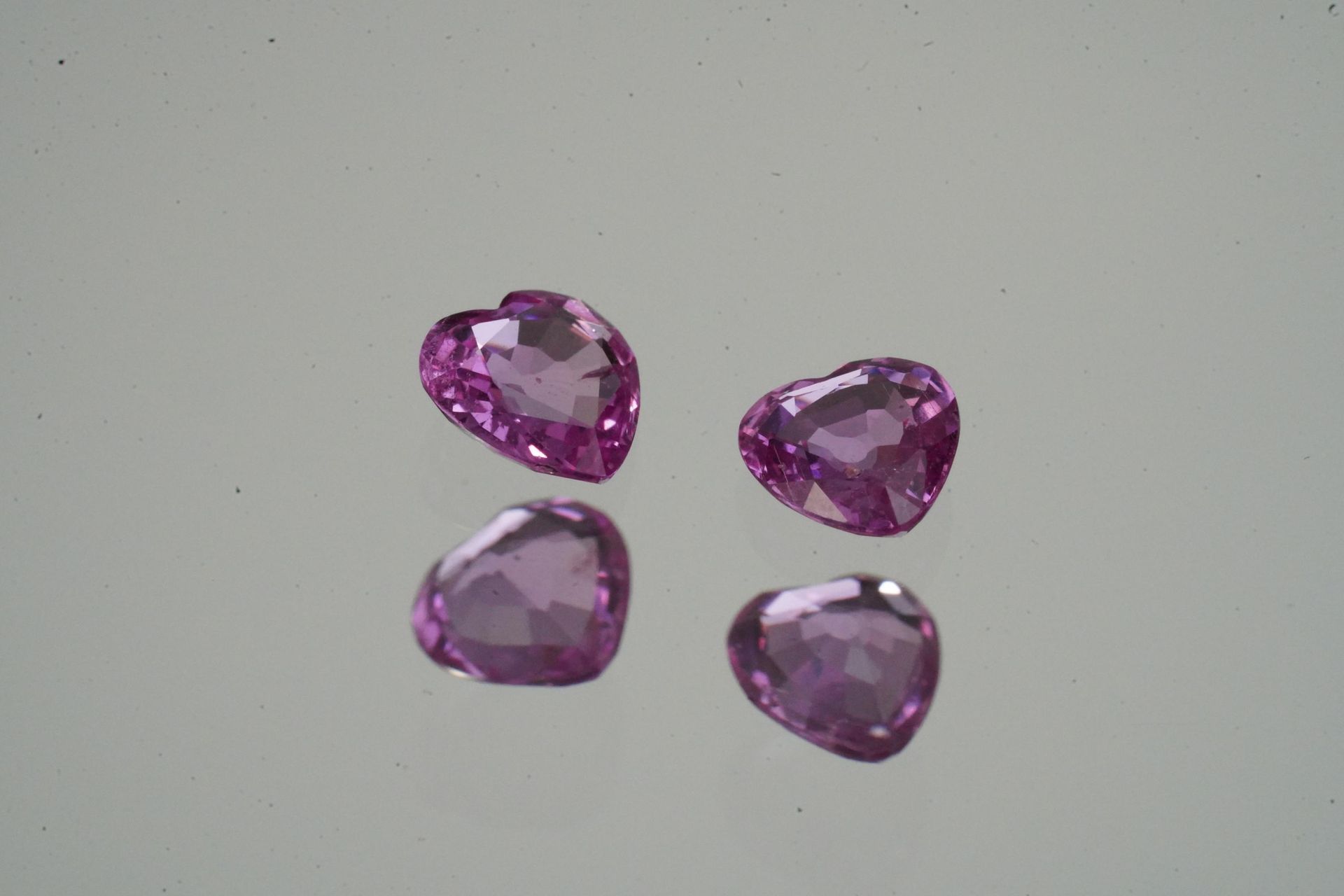 Null TWO PINK SAPHIRS on paper, heart shape, about 2.19 carats. Intense bright p&hellip;