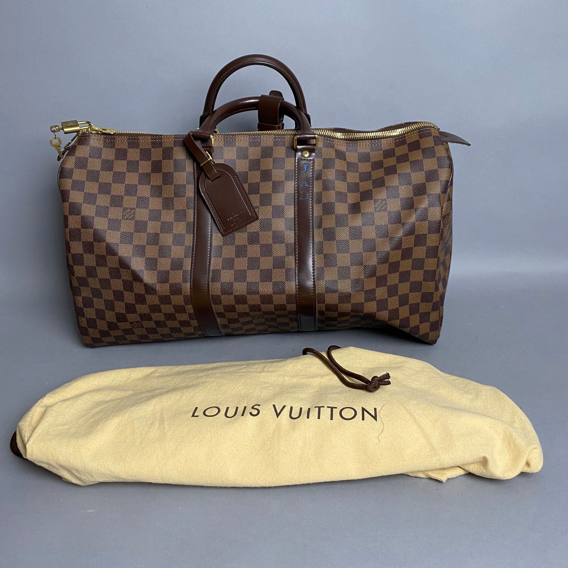 LOUIS VUITTON. Travel bag Keepall model in brown canvas …
