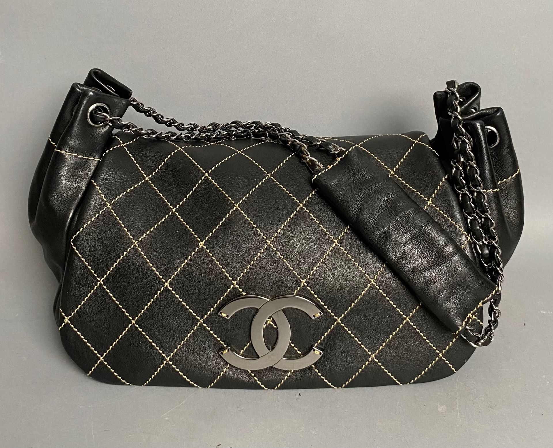 CHANEL. Shoulder bag in brown soft leather with checkerb…