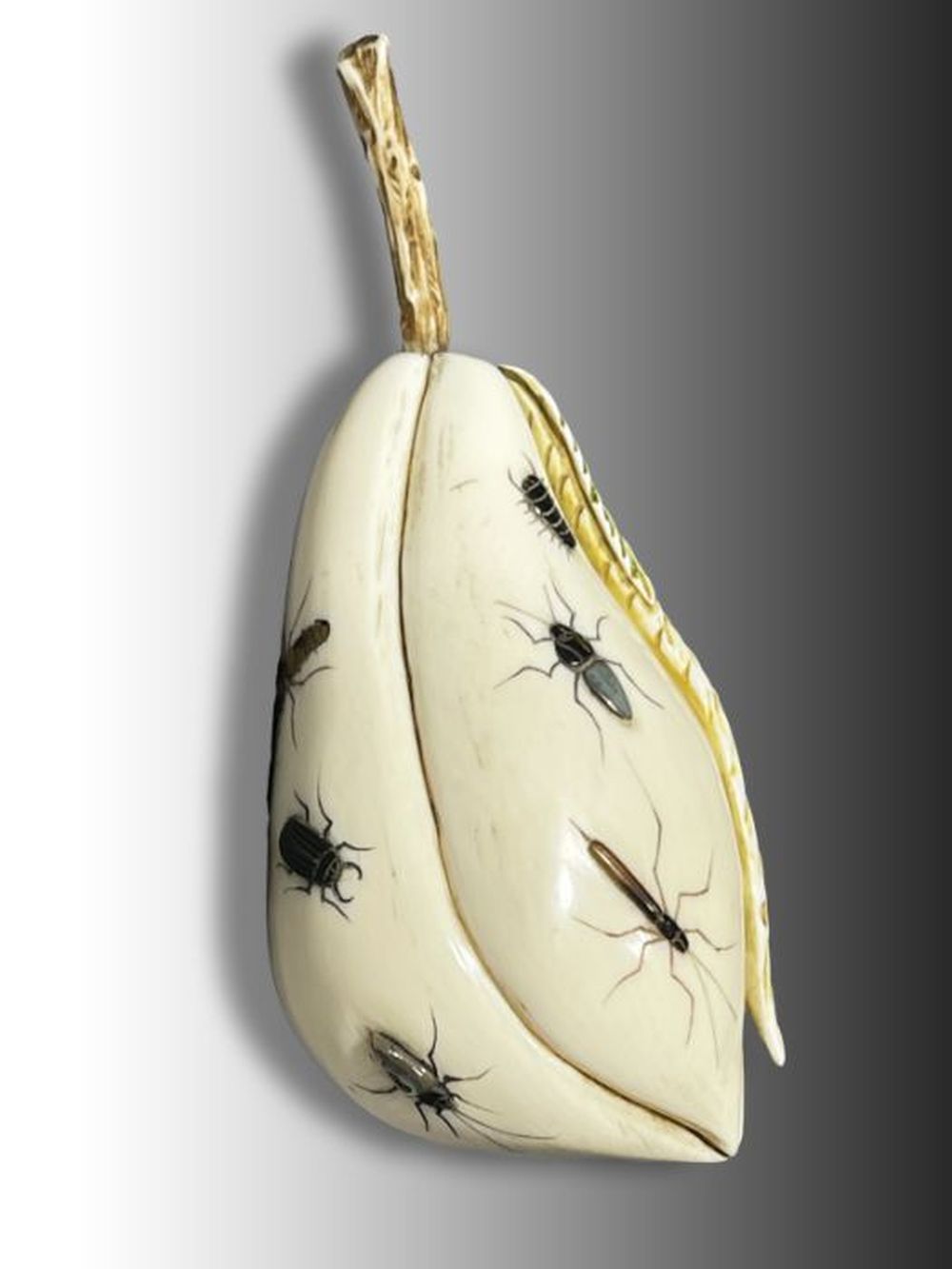 A JAPANESE SHIBAYAMA OKIMONO OF A PEAR WITH MOTHER OF PEARL BUG INLAYS, SIGNED M&hellip;