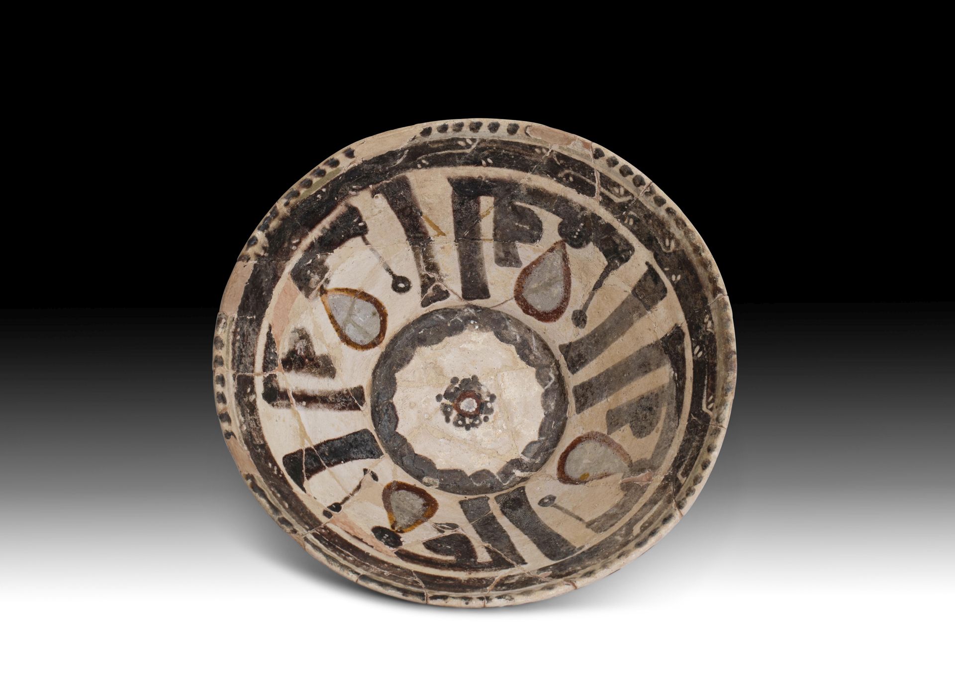 AN ISLAMIC CERAMIC BOWL DECORATED IN BLACK & BROWN INK, PROBABLY NISHAPUR, 10TH &hellip;