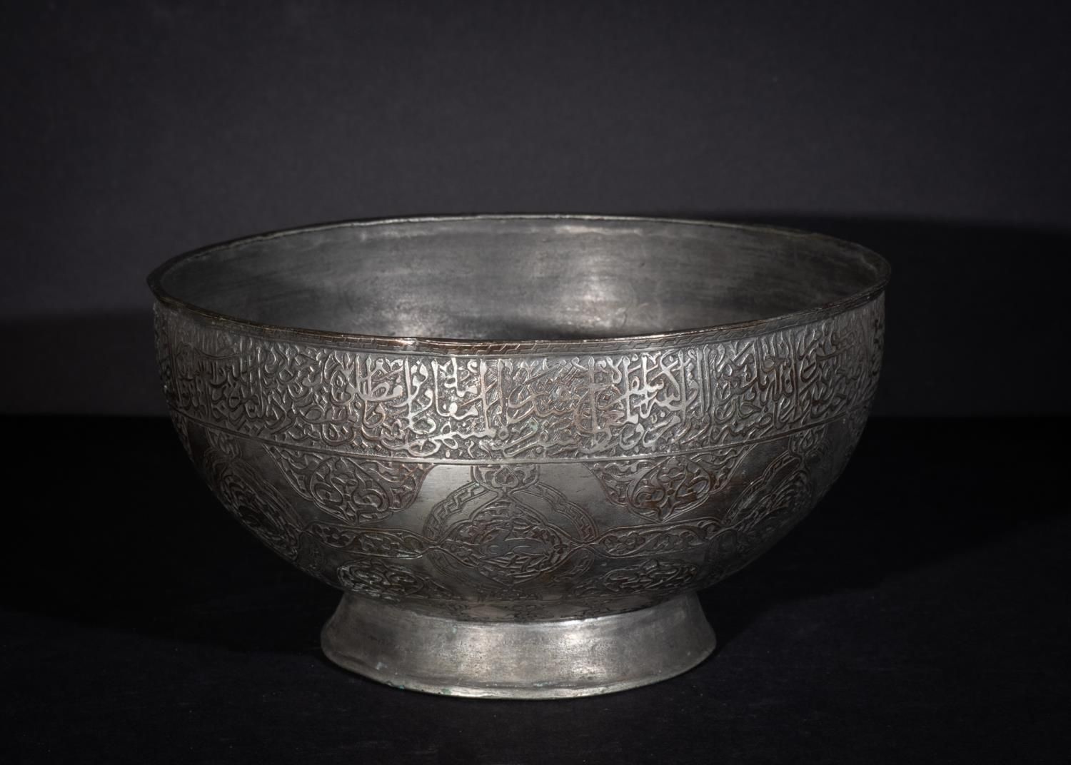 Null AN ISLAMIC FOOTED TINNED COPPER BASIN LATE SAFAVID, 18TH CENTURY
 
 Height:&hellip;