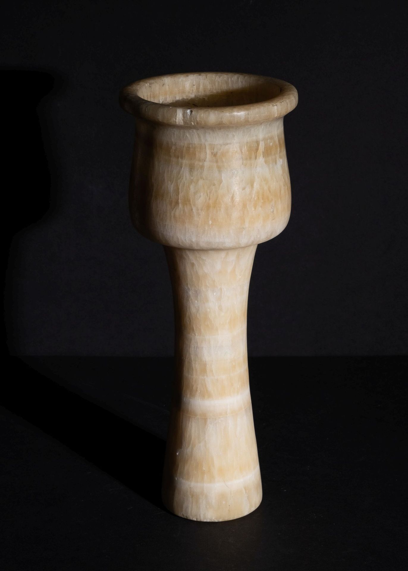 Null AN ALABASTER GOBLET IN THE STYLE OF BACTRIAN OR LATER
 
 Height:25cm