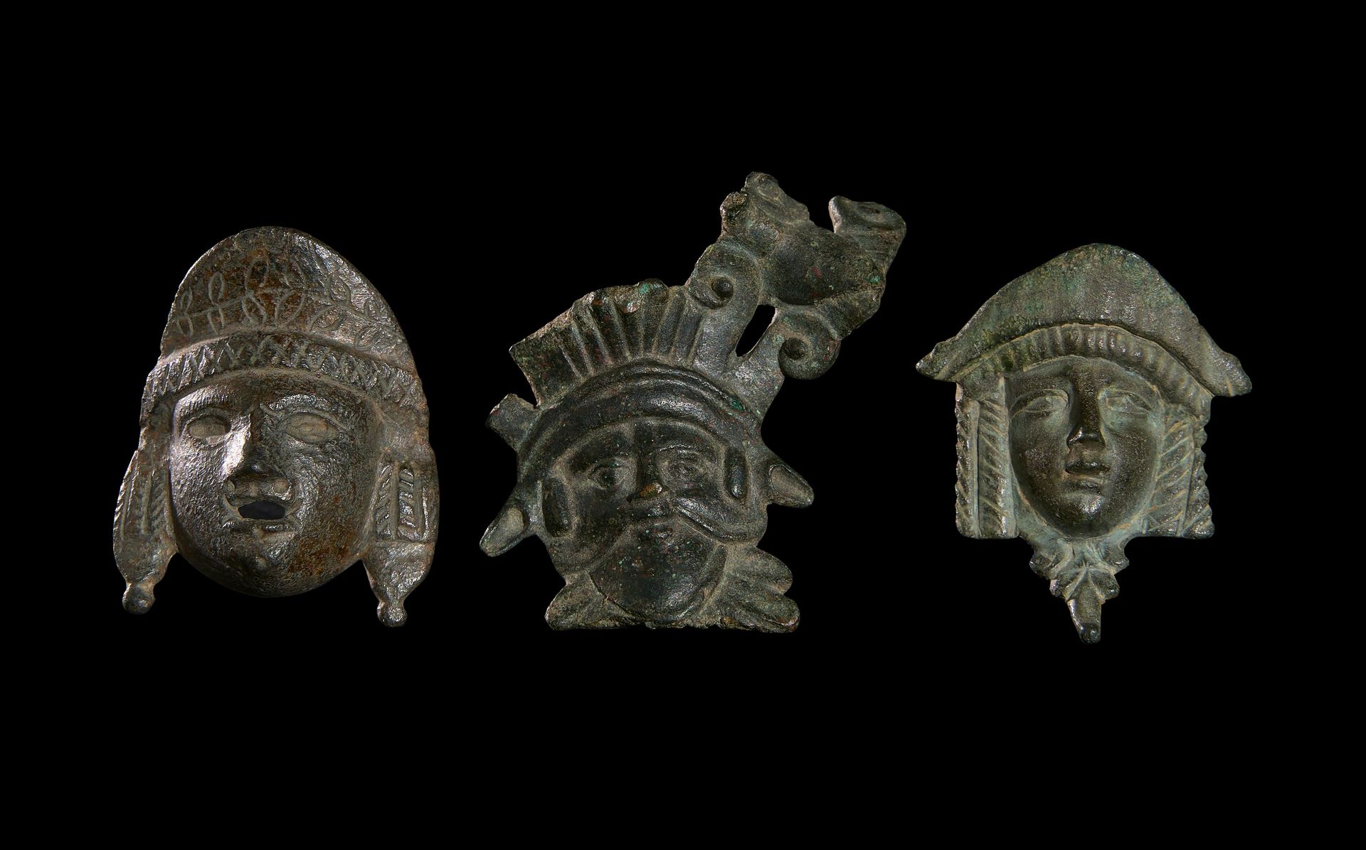 THREE BRONZE ROMAN MASKS, CIRCA 1ST CENTURY A.D. TRE MASCHERE ROMANE IN BRONZO, &hellip;