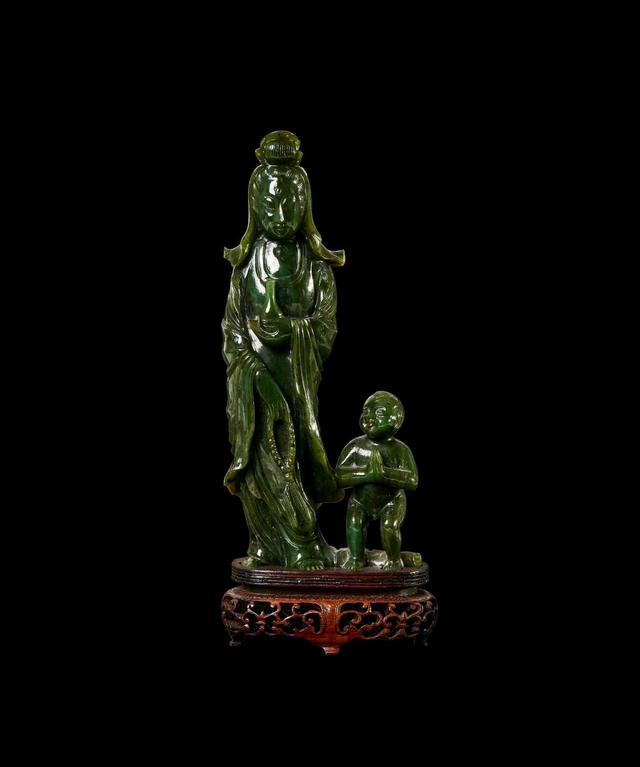 A FINE CHINESE DEEP SPINACH JADE FIGURE OF GUANYIN AND ATTENDANT UNE FINE FIGURI&hellip;