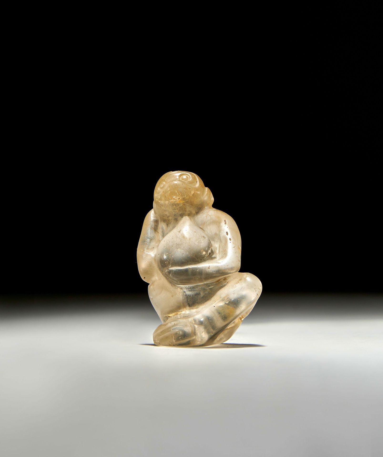 A BACTRIAN ROCK CRYSTAL FIGURINE OF A SEATED MONKEY, CIRCA 2ND MILLENIUM B.C. EI&hellip;