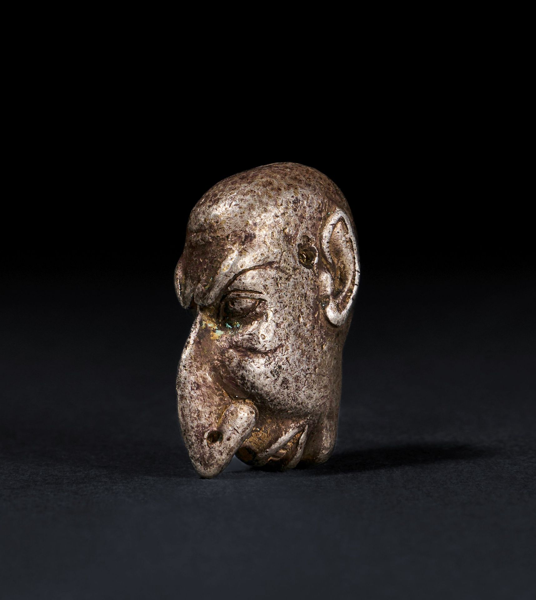 A ROMAN SOLID SILVER AMULET OF A "GROTESK" FACE, CIRCA 1ST-2ND CENTURY A.D. AMUL&hellip;