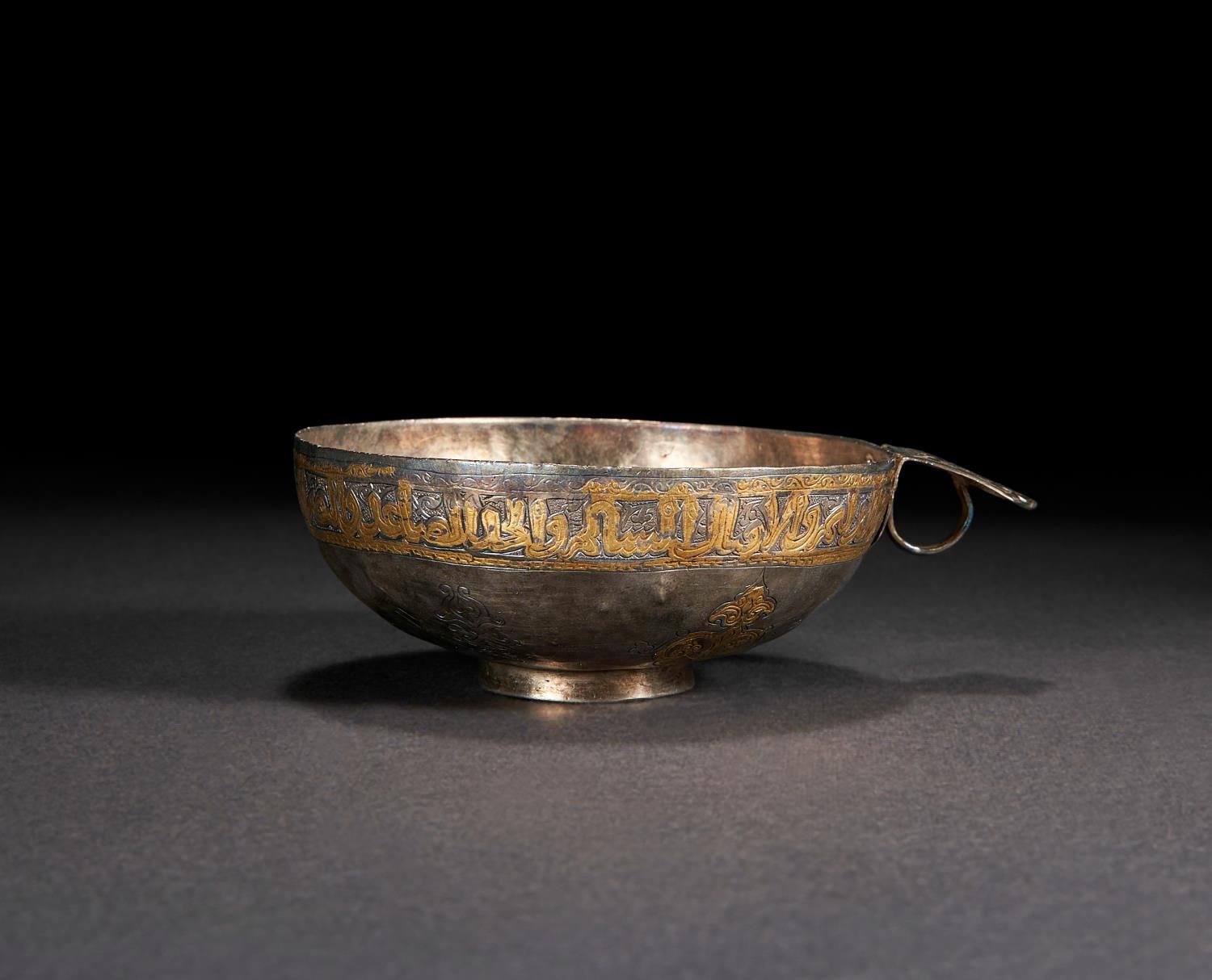 AN IMPORTANT INSCRIBED PARCEL-GILT SILVER SOGDIAN SADDLE CUP, CENTRAL ASIA, 7TH-&hellip;