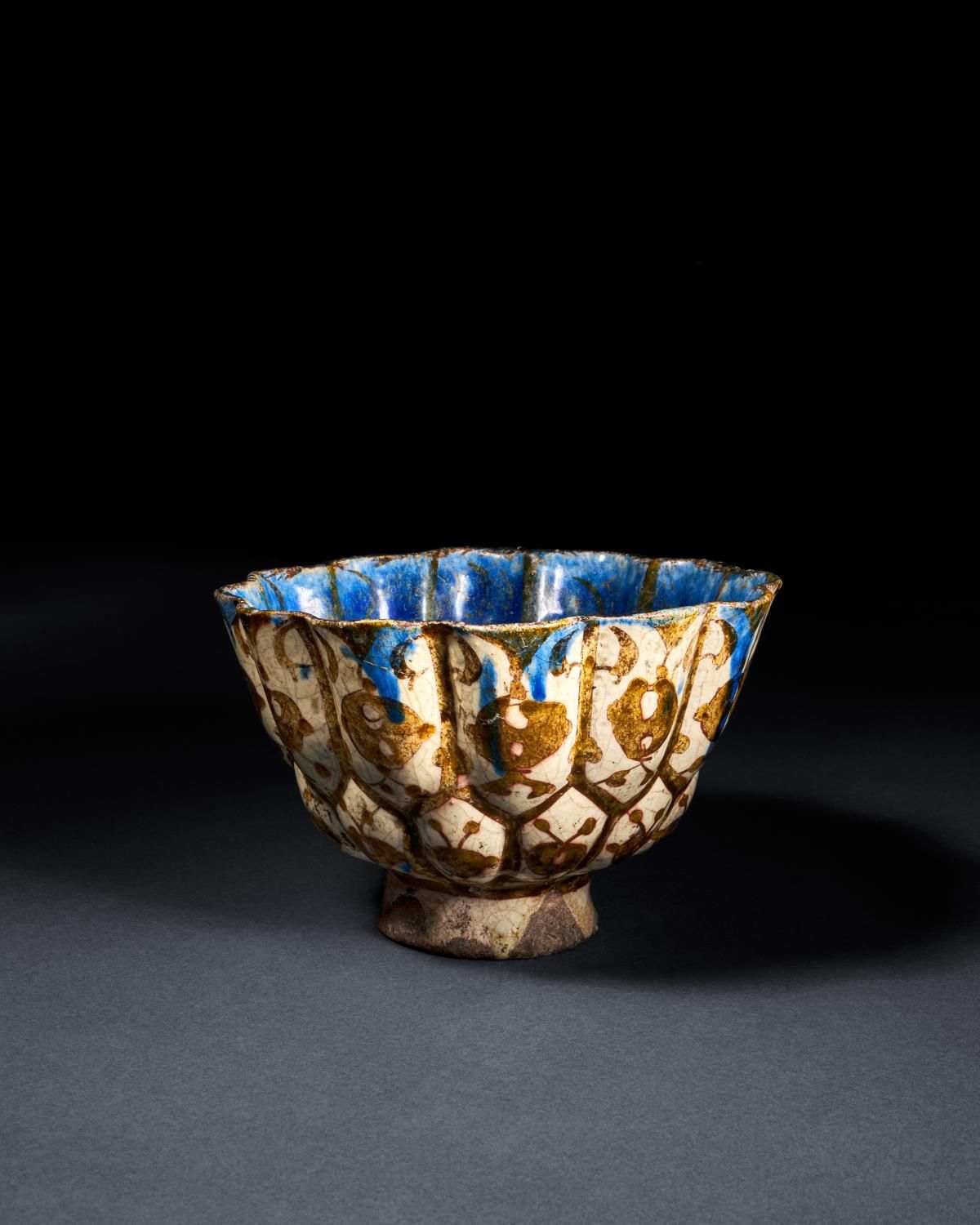 A RARE BLUE SLIP PAINTED KASHAN LUSTRE POTTERY BOWL, CENTRAL IRAN, EARLY 13TH CE&hellip;