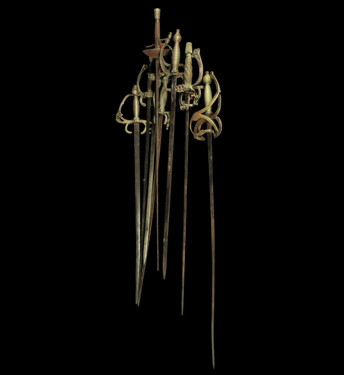 Null Lot de 8 épées, 20e siècle
En acier et bronze doré
