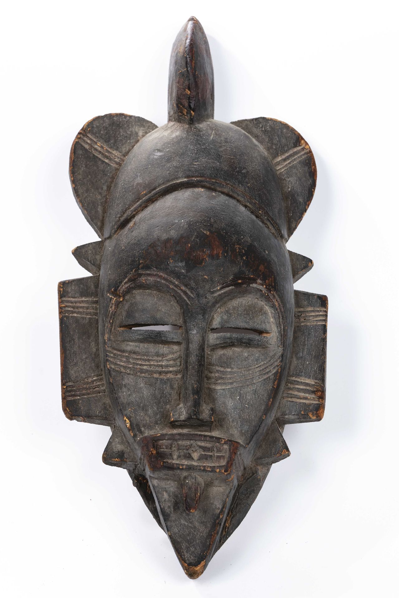 Null Maske im Stil der Senoufo Elfenbeinküste. 
Holz 
H: 35 cm 
 Die Pometten, d&hellip;