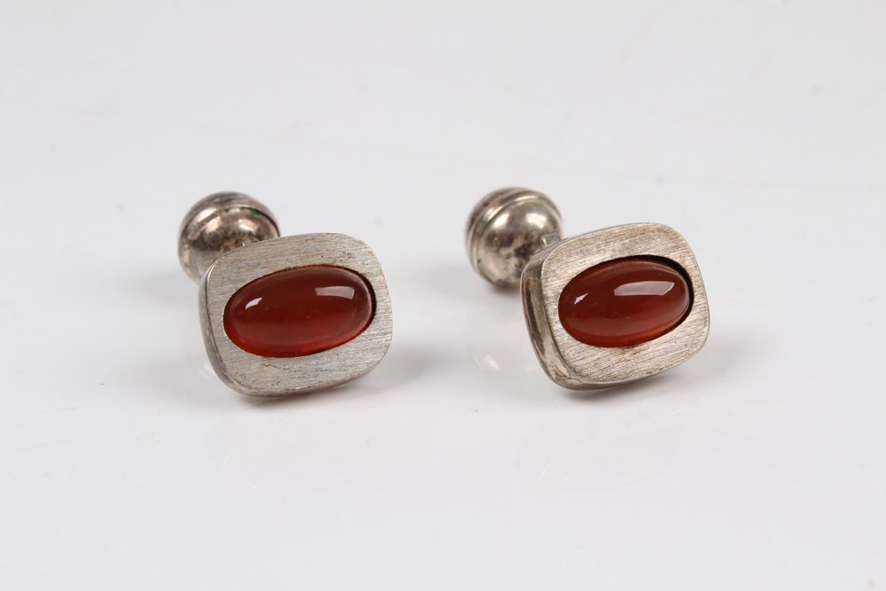 Null Pair of cufflinks. Silver 835, set with amber.