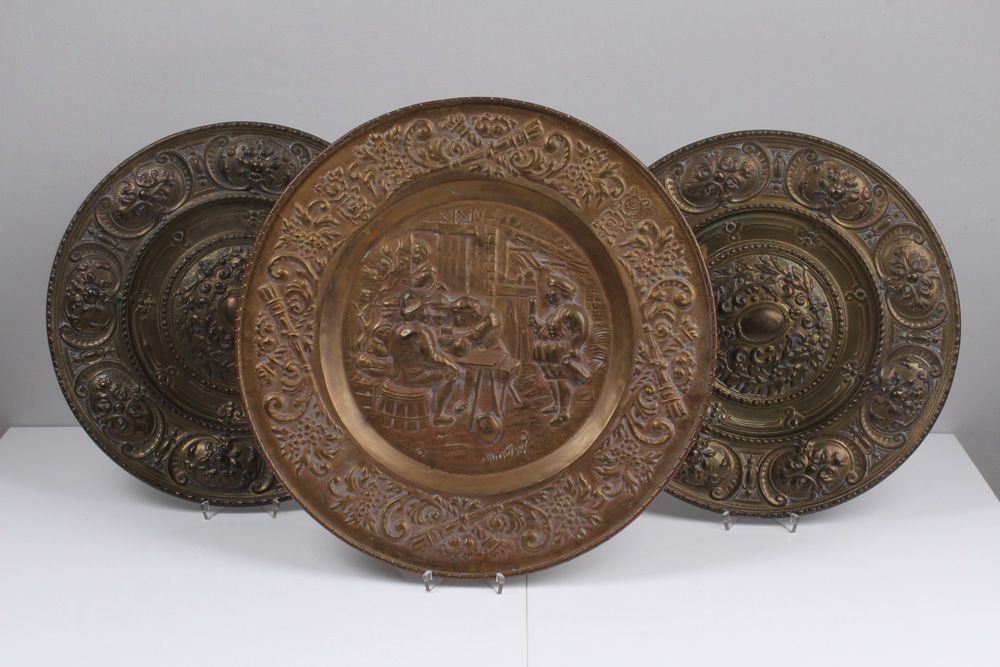 Null Three wall plates. Late 19th century. Embossed brass with Renaissance decor&hellip;