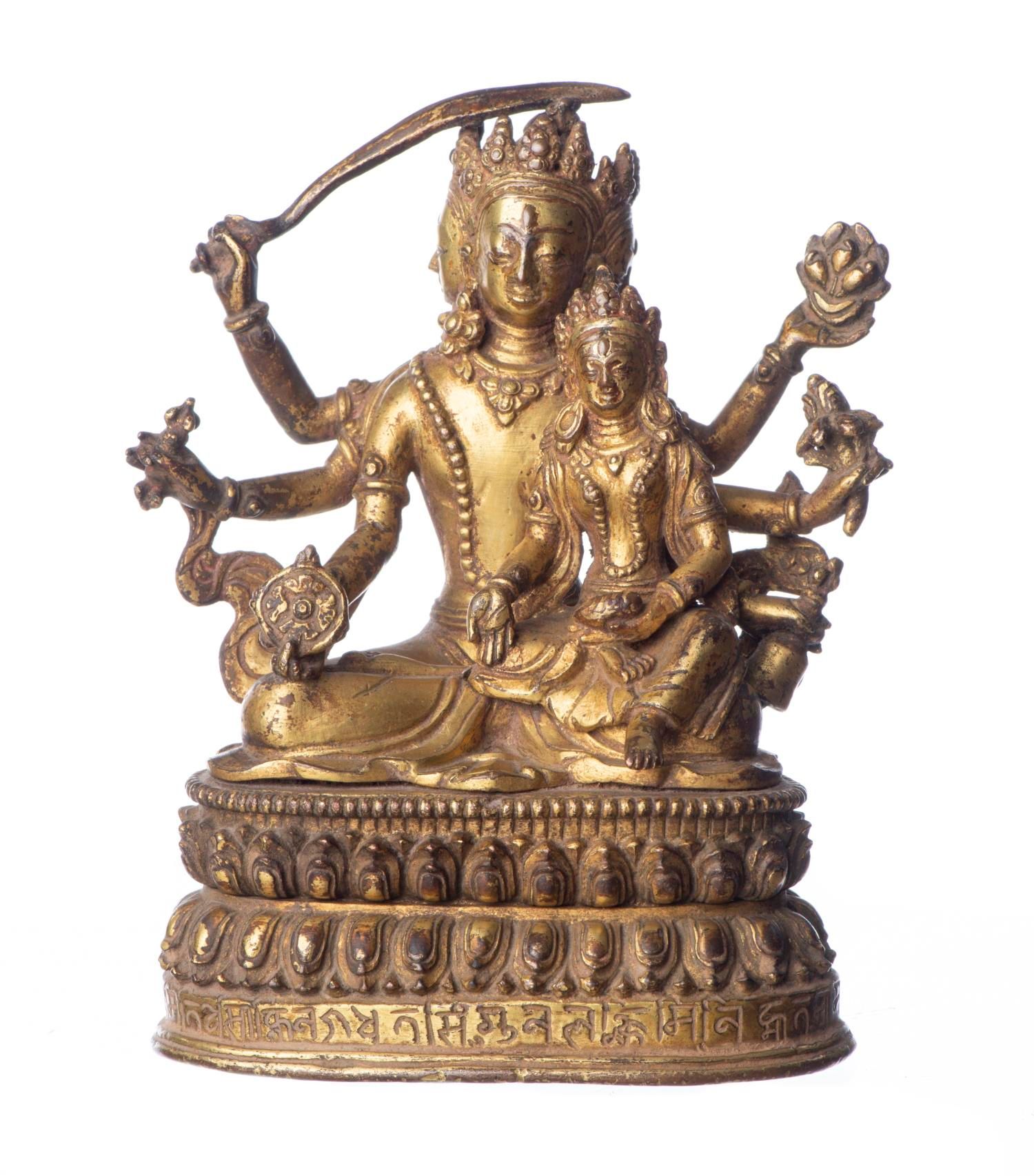 Null 鎏金青铜，莲花状底座，三头菩提萨埵，左膝上抱着一尊儿童佛。

H.12.6厘米

出处：
来自日内瓦的古老私人收藏，1971/72年在尼泊尔购买。