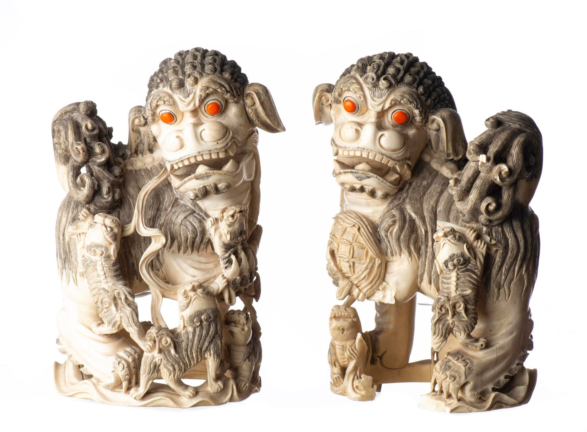 Null CHINA. Two Hong Kong Chinese ivory Fo lions or shishi, one accompanied by i&hellip;