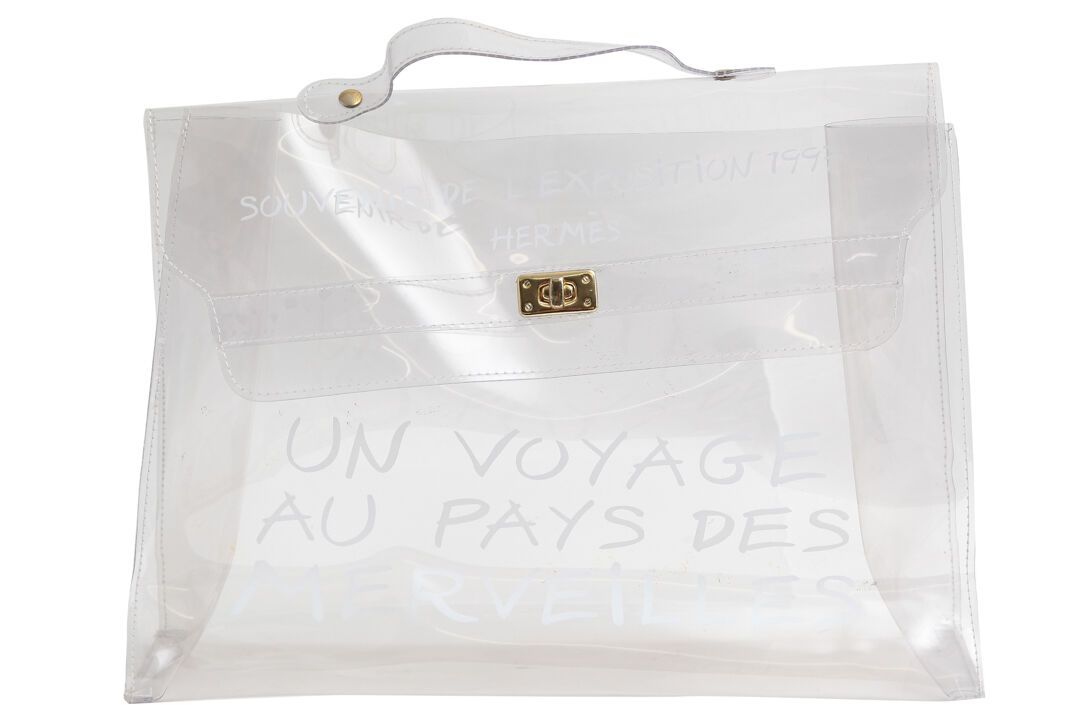 HERMES An Hermès transparent vinyl souvenir bag from the Kelly bag exhibition, 1&hellip;