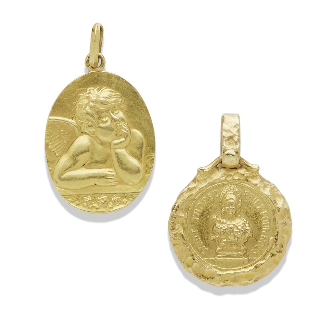 Null 两枚金质奖章

18K金（750），第一枚奖牌显示一个天使，背面有字母图案，第二枚显示圣特罗佩，法国金印，总重量：7.57克。

两块18K金奖牌
