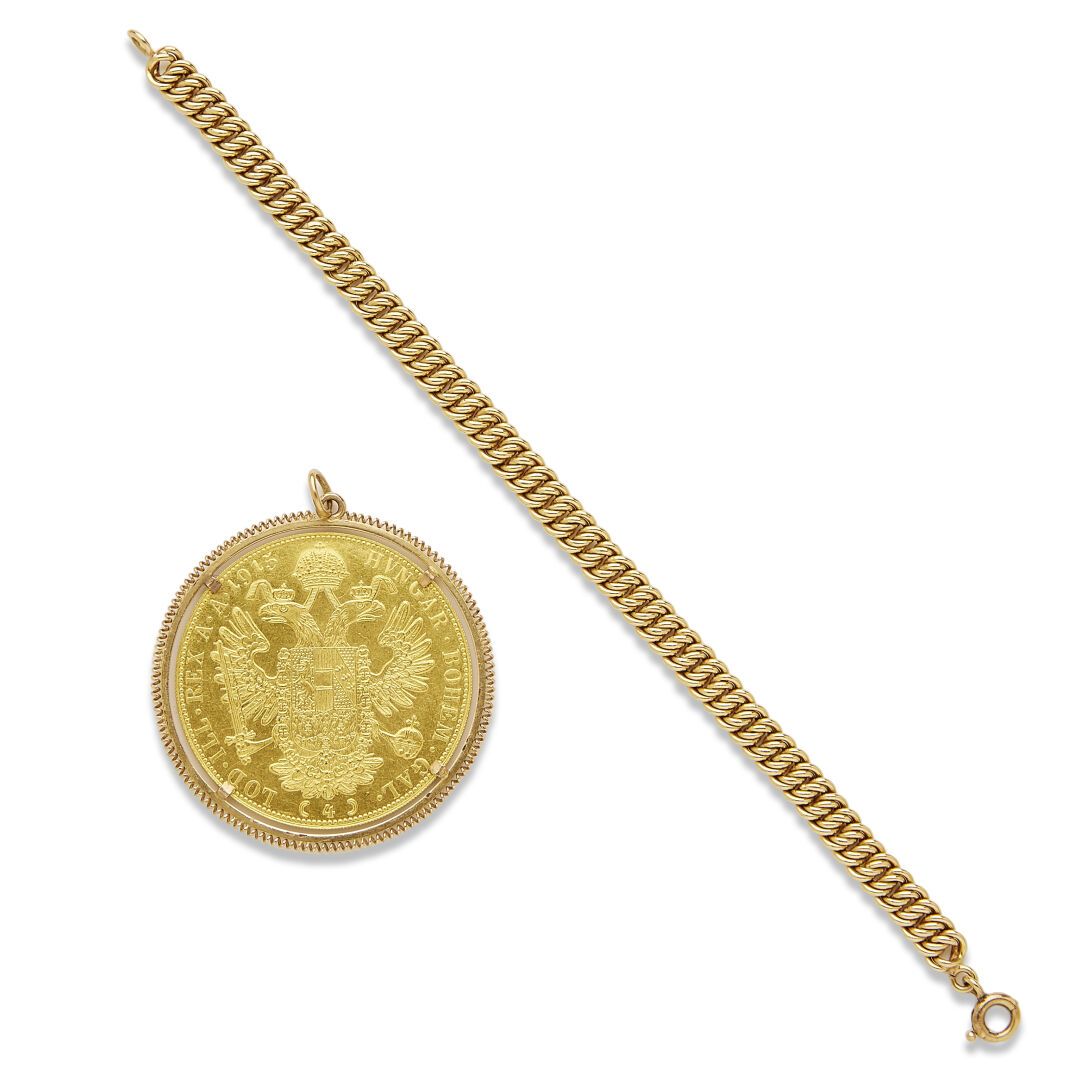 Null Pendentif et bracelet en or

Le pendentif en or 18K (750) orné d'une pièce &hellip;