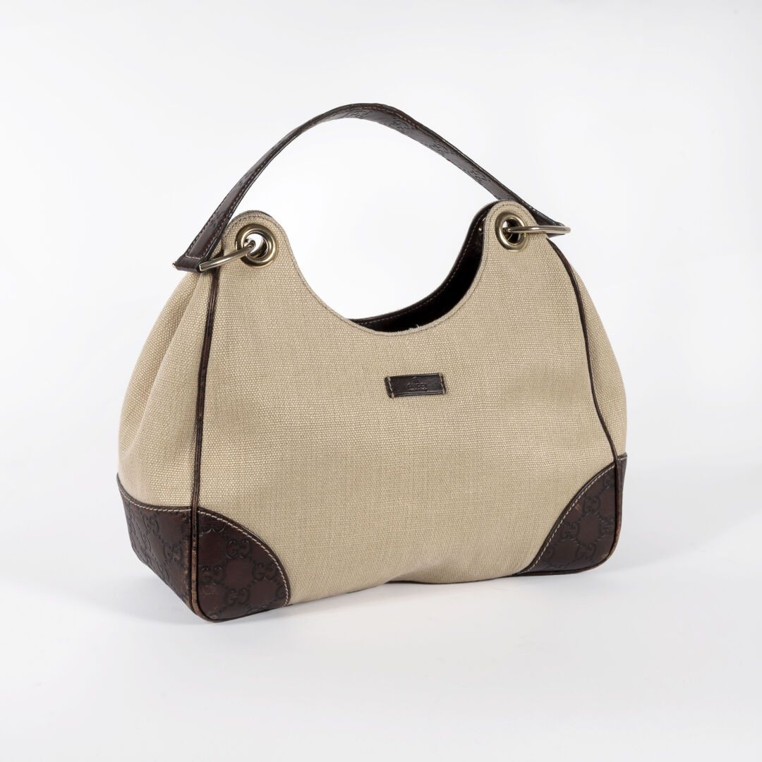 GUCCI Handbag in beige canvas and brown leather monogram, inside brown fabric

L&hellip;
