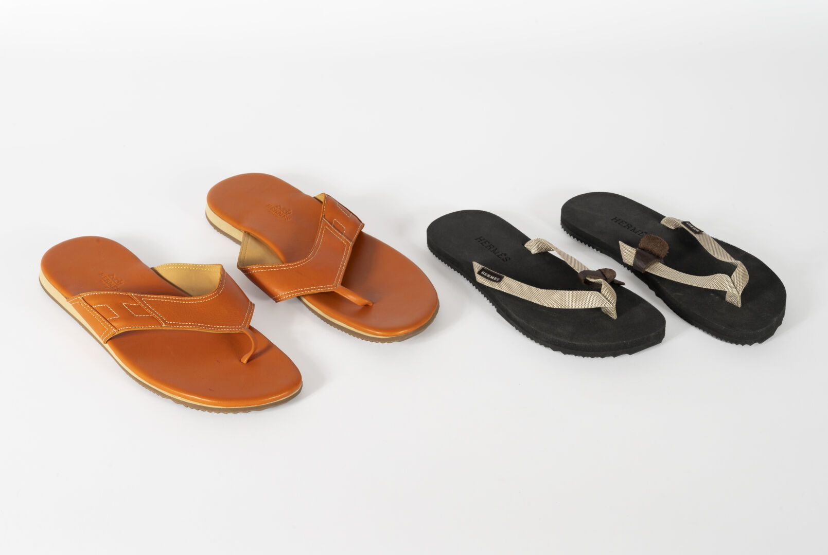 HERMES Two pair of flip flops, one pair in orange leather size 45 and one pair i&hellip;