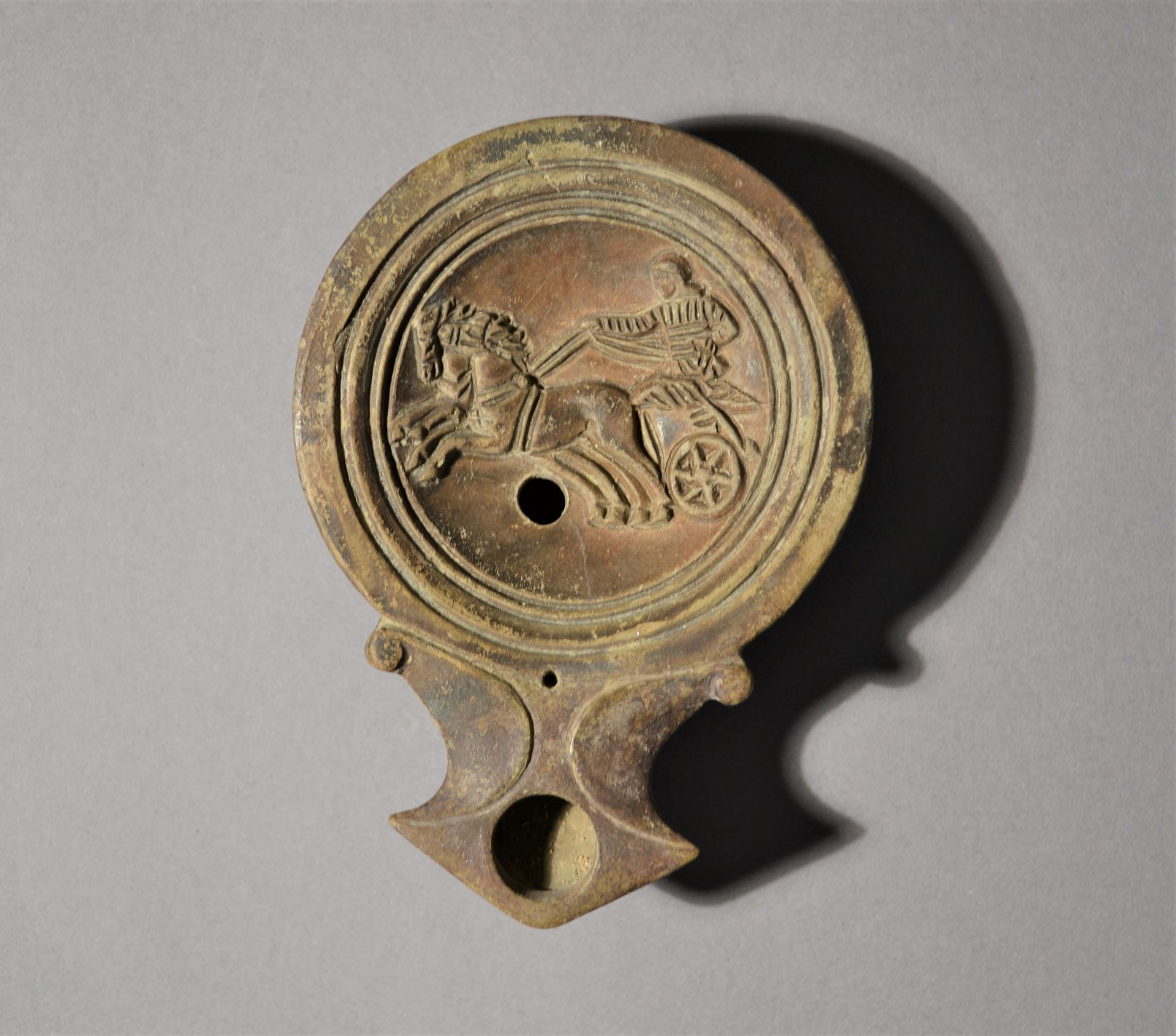 Roman Terracotta Oil Lamp with Biga 
 
   
 
 Roman Empire, 1st century A.D. / t&hellip;