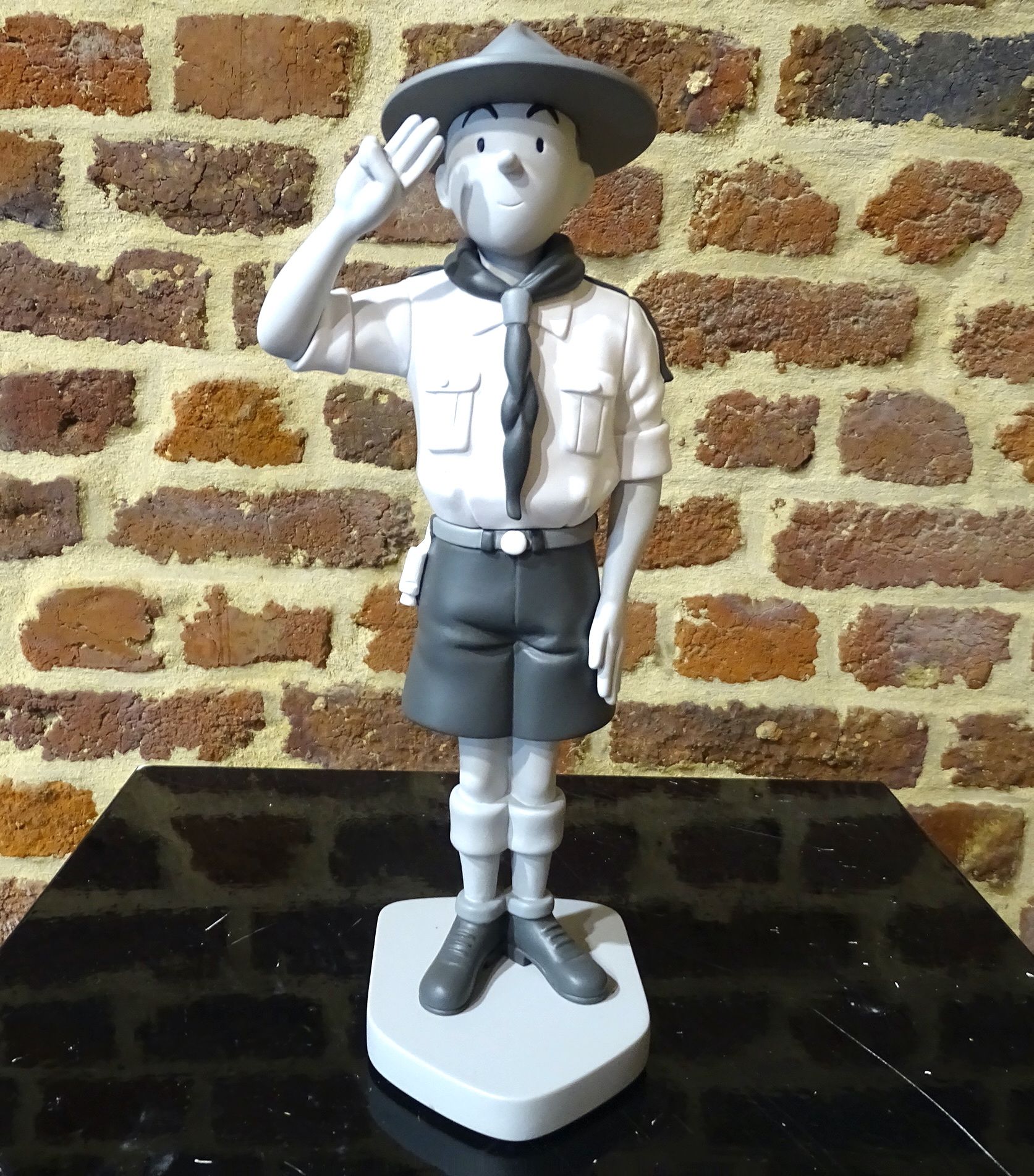 Tintin & Hergé Statue of Tintin at the scouts. Also a topper in black and white,&hellip;