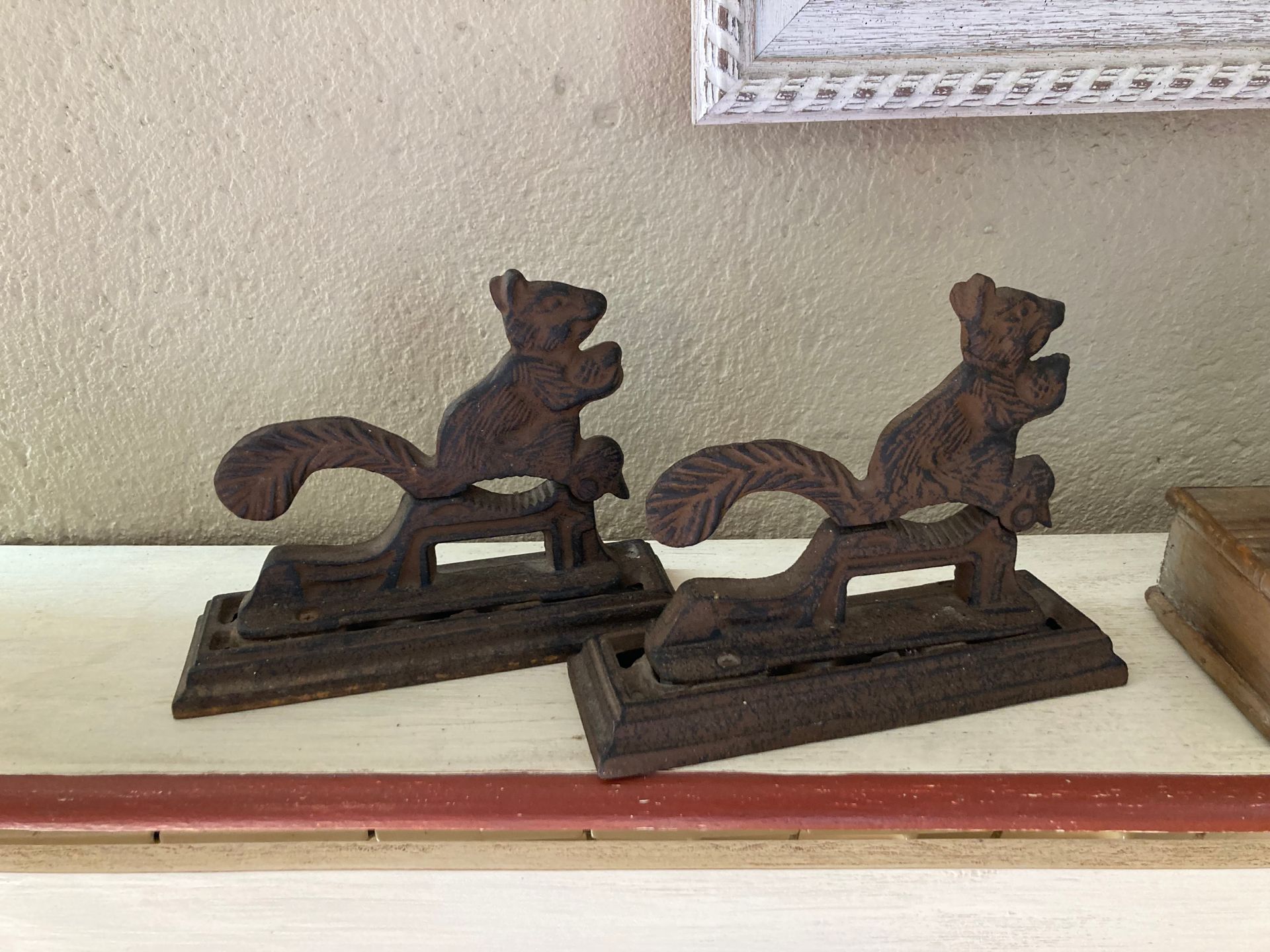 Null Set including two cast iron nutcrackers featuring a squirrel, and a candle &hellip;
