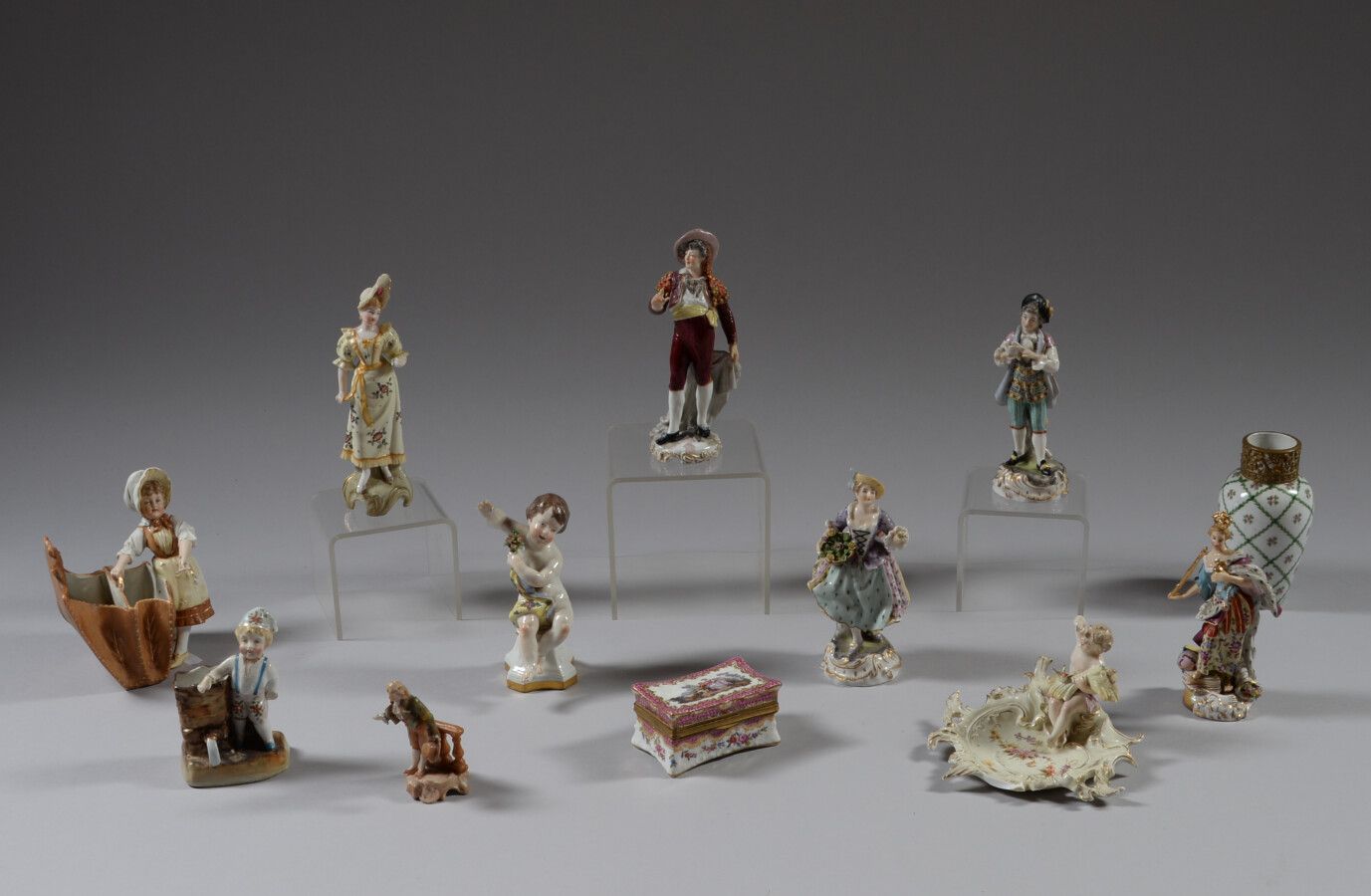 Null Twelve polychrome porcelain or biscuit subjects representing children, char&hellip;