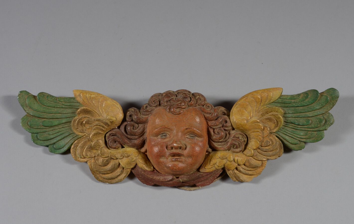 Null Eléments décoratif en plâtre polychrome représentant une tête d'angelot.

L&hellip;