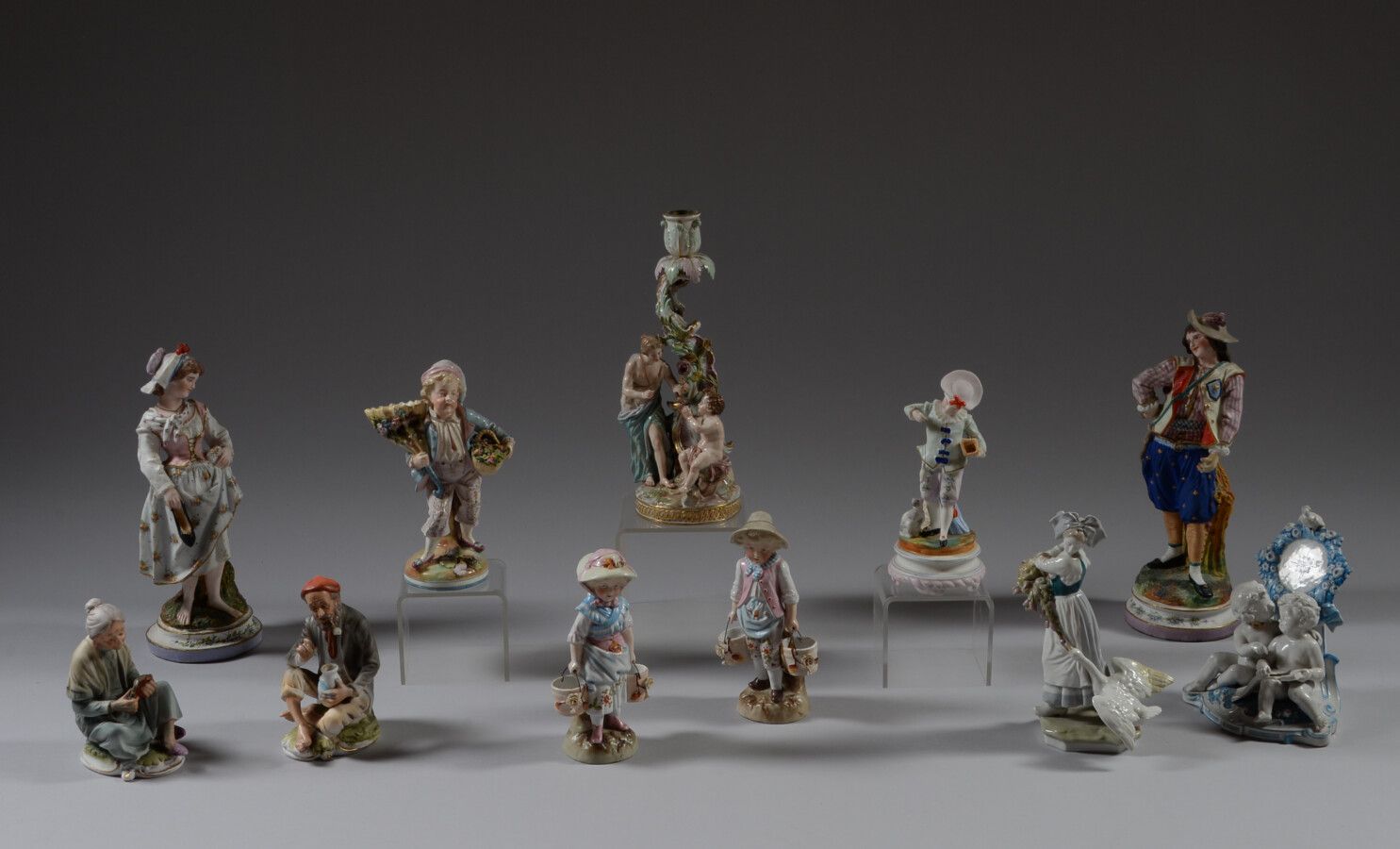 Null Eleven polychrome porcelain or biscuit subjects representing couples, chara&hellip;